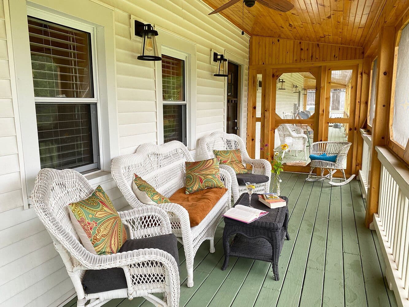 The screened-in porch is a great place for relaxing with books from our library