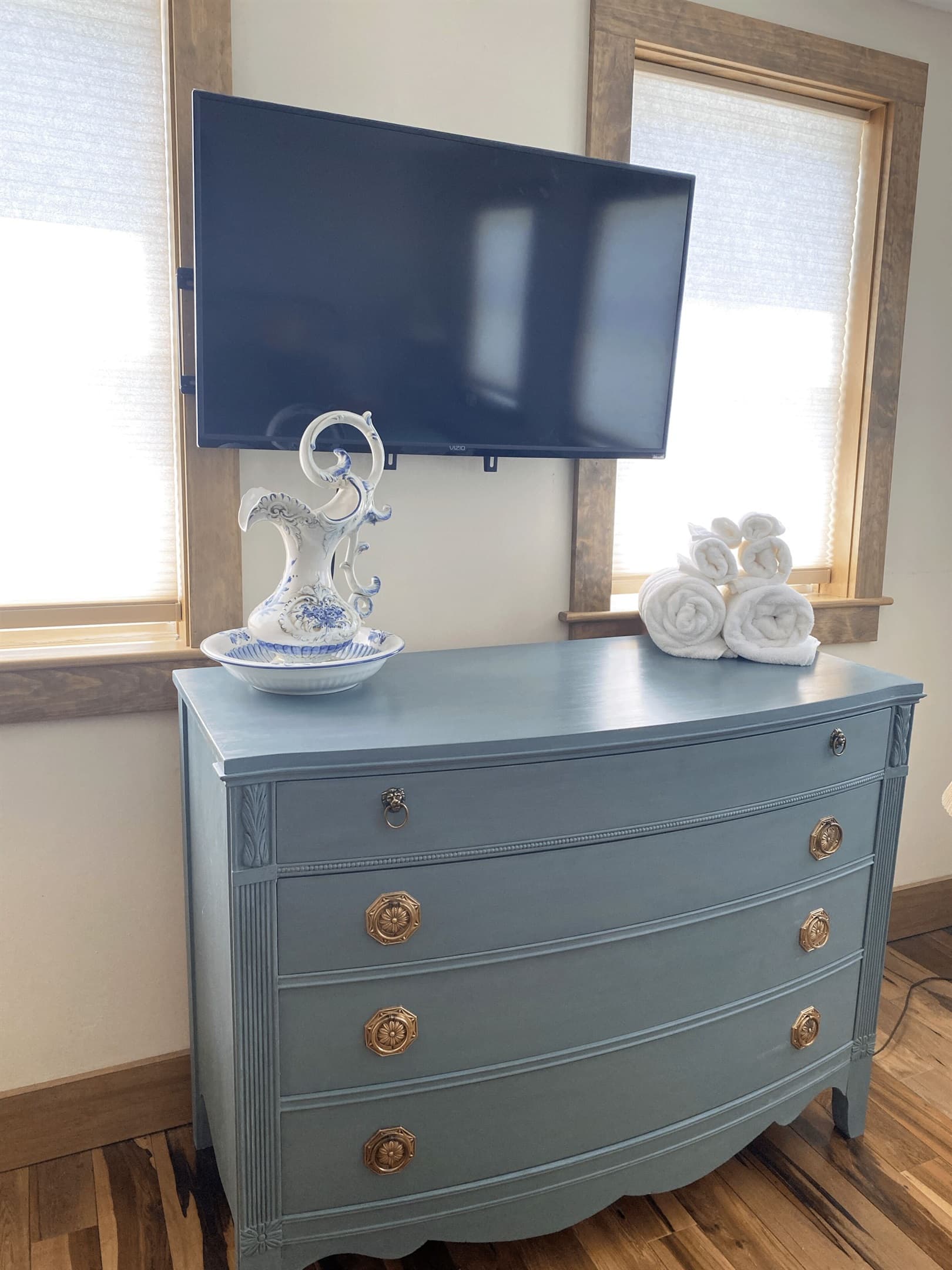 Chalk painted furniture and TV in second floor queen bedroom