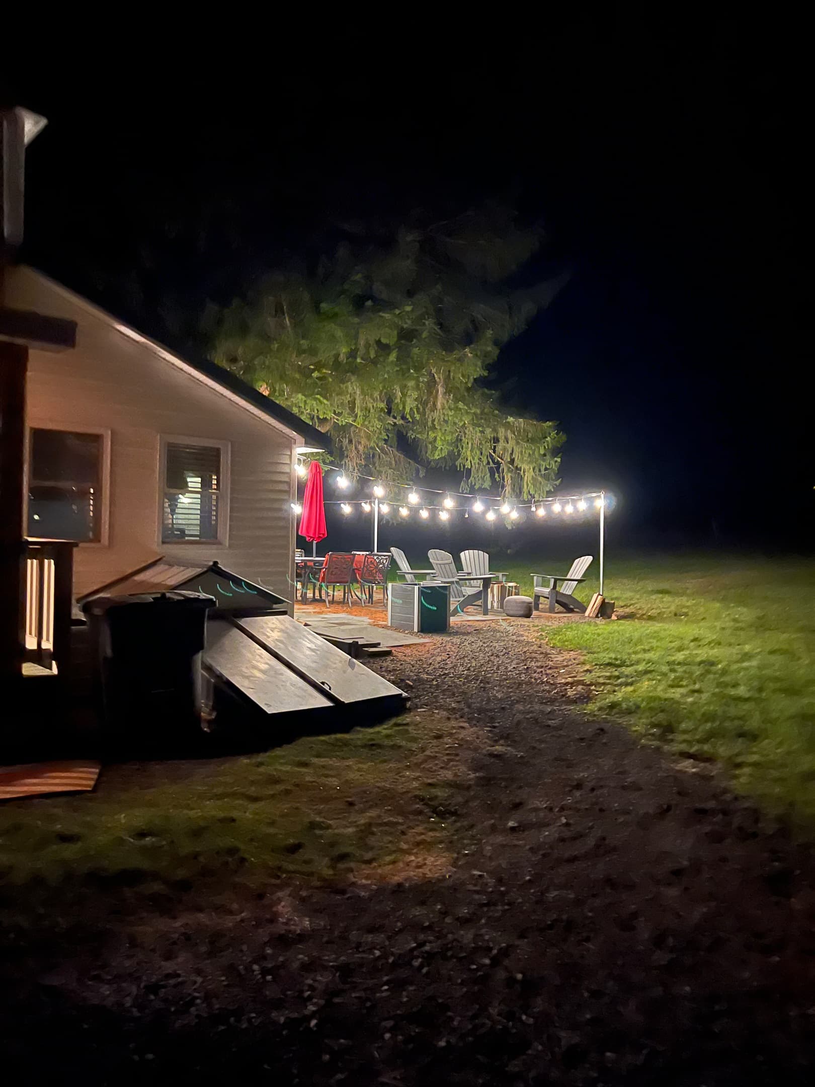 back patio with string lights and firepit