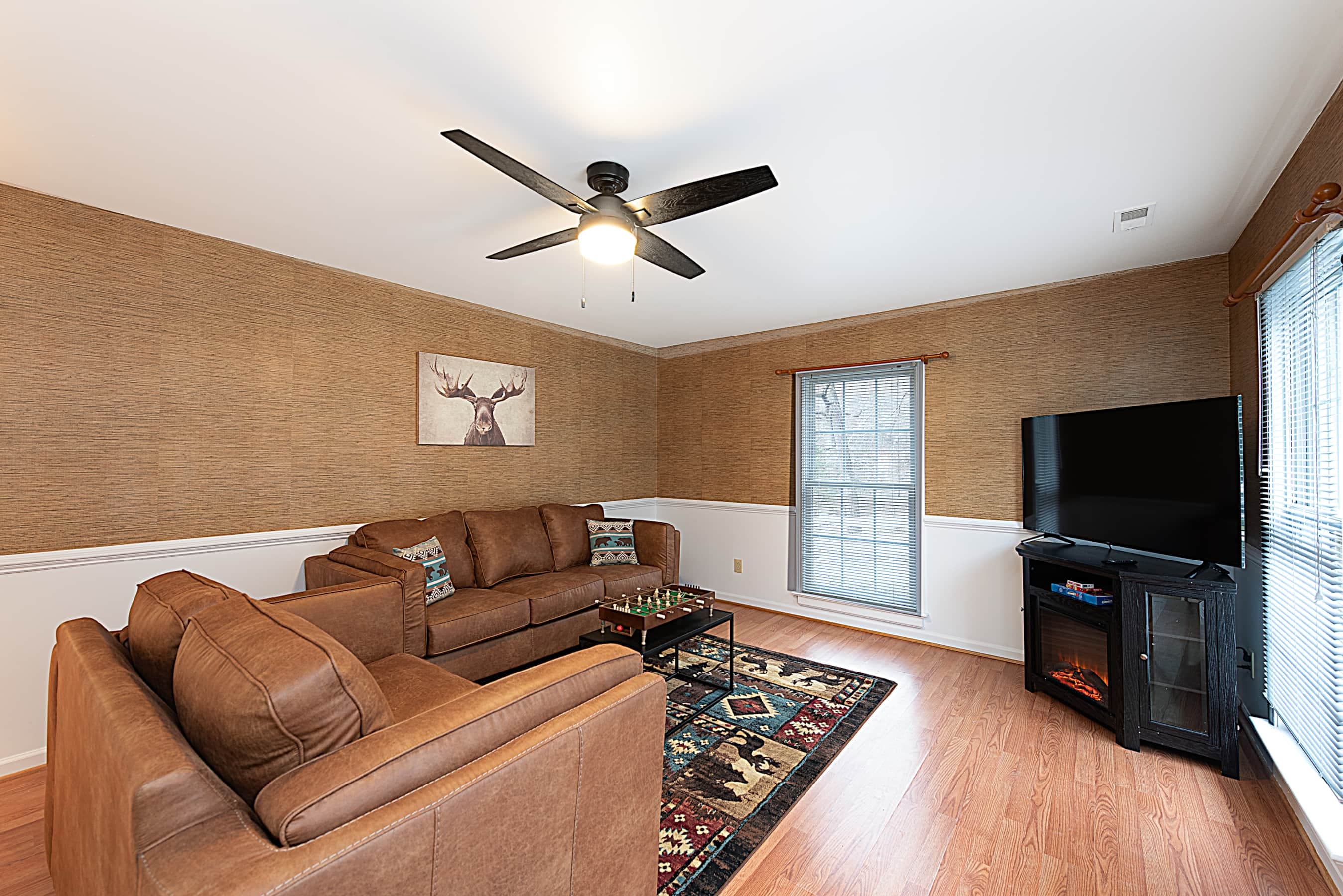 Living Room with Electric Fireplace and 55" TV