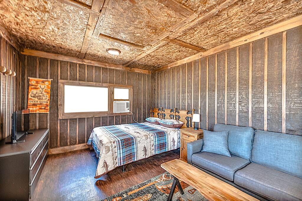 Cottage with Bed, small living space, keurig, mini fridge, and microwave. Cottage $50 Extra a night