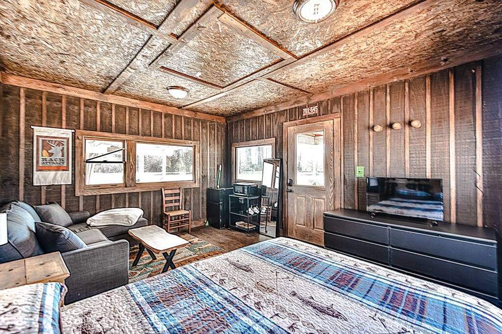 Cottage with Bed, small living space, keurig, mini fridge, and microwave. Cottage $50 Extra a night