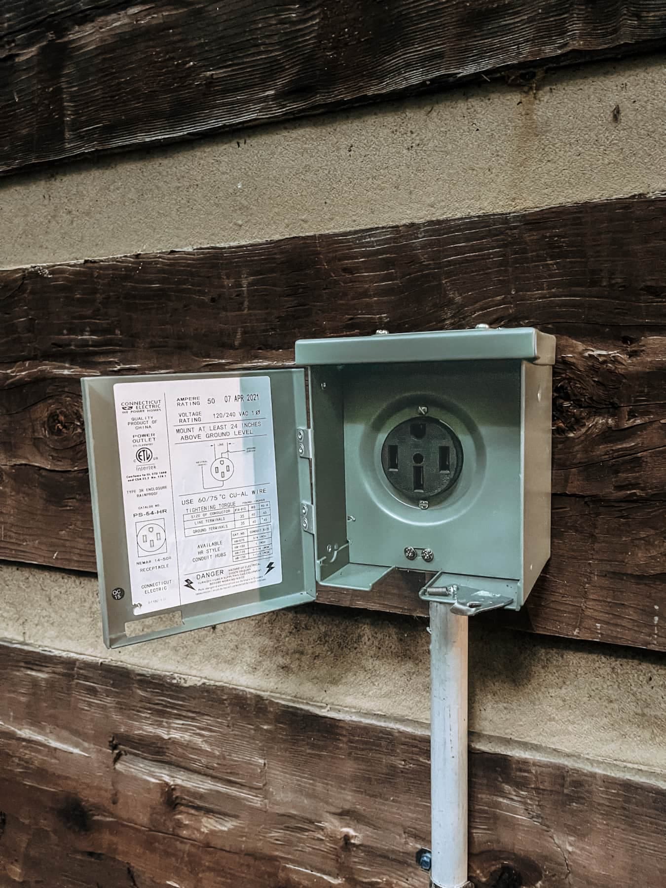 Level 2 EV charger on front of house