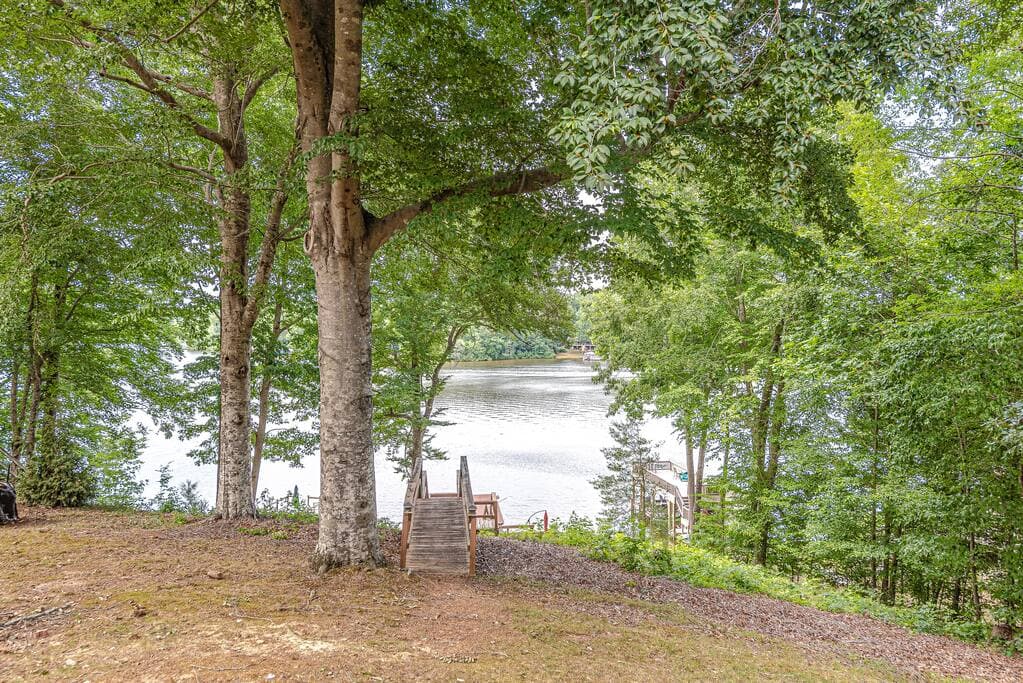 Shared backyard space with pathway to dock