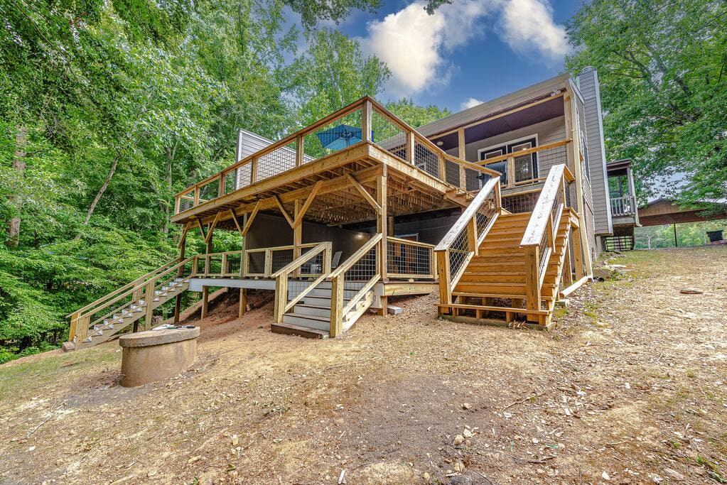 Rear of home with brand new decks overlooking the lake