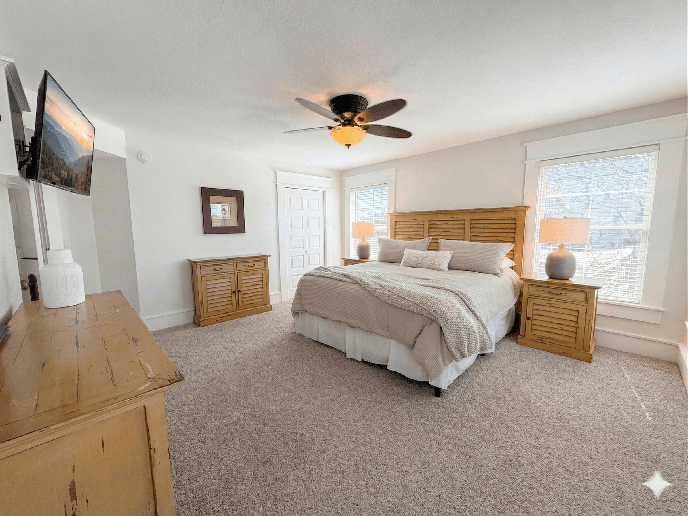 Bedroom 3 — Elegant King Bed with Decorative Headboard & Warm Tones | Luxury Accommodations at The Mark Twain, Outer Banks