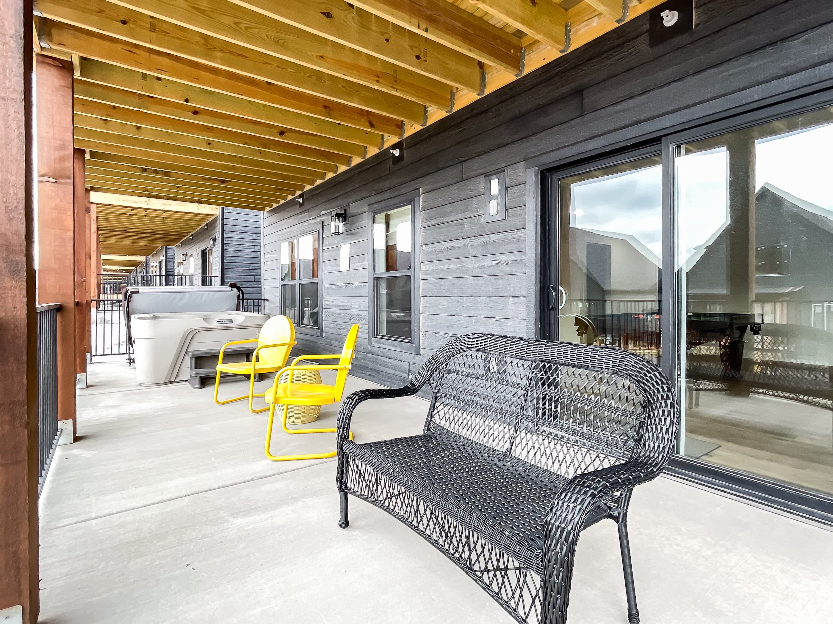 Seating on lower patio with sliding doors