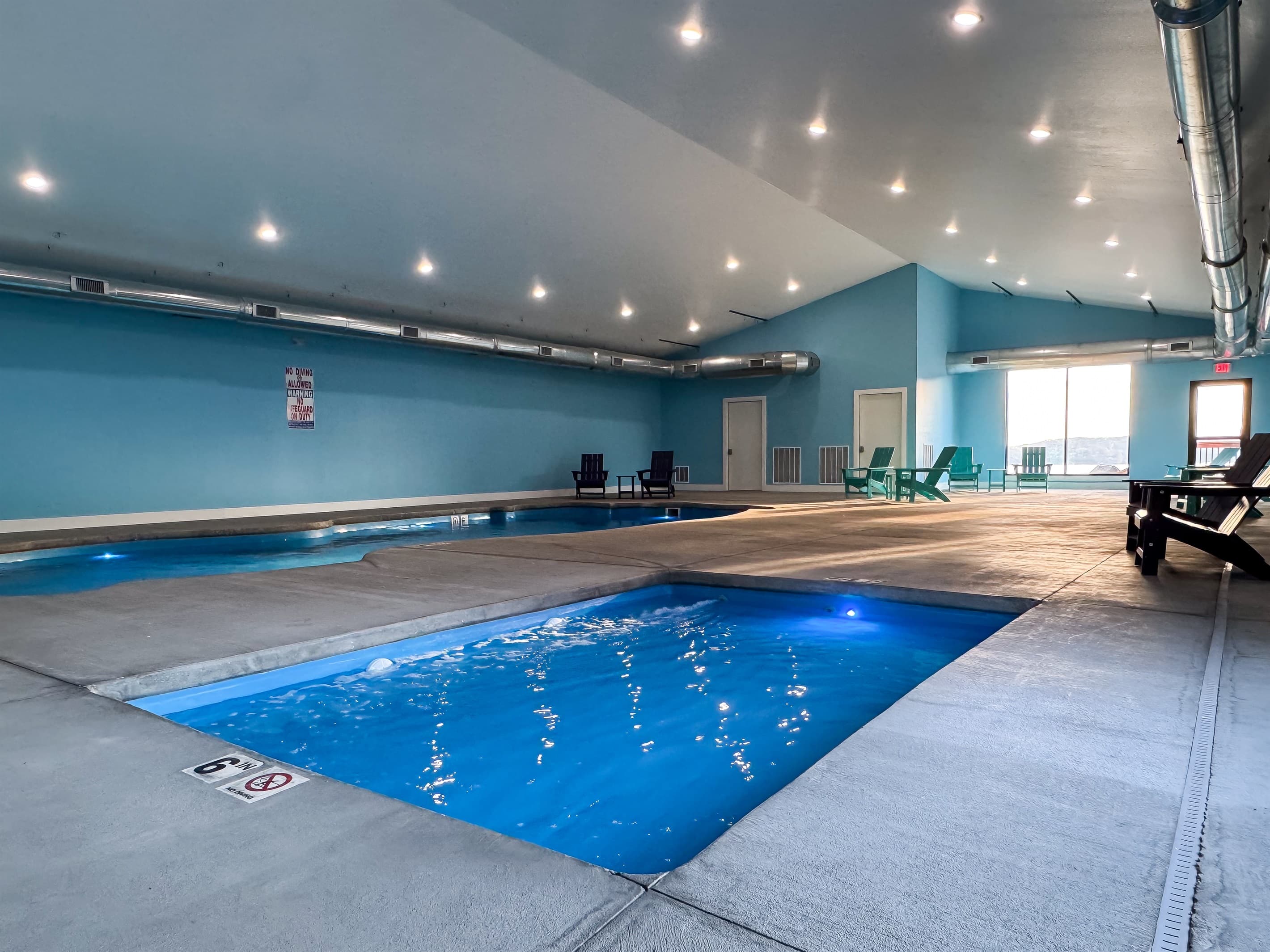 Indoor hot tub next to indoor pool