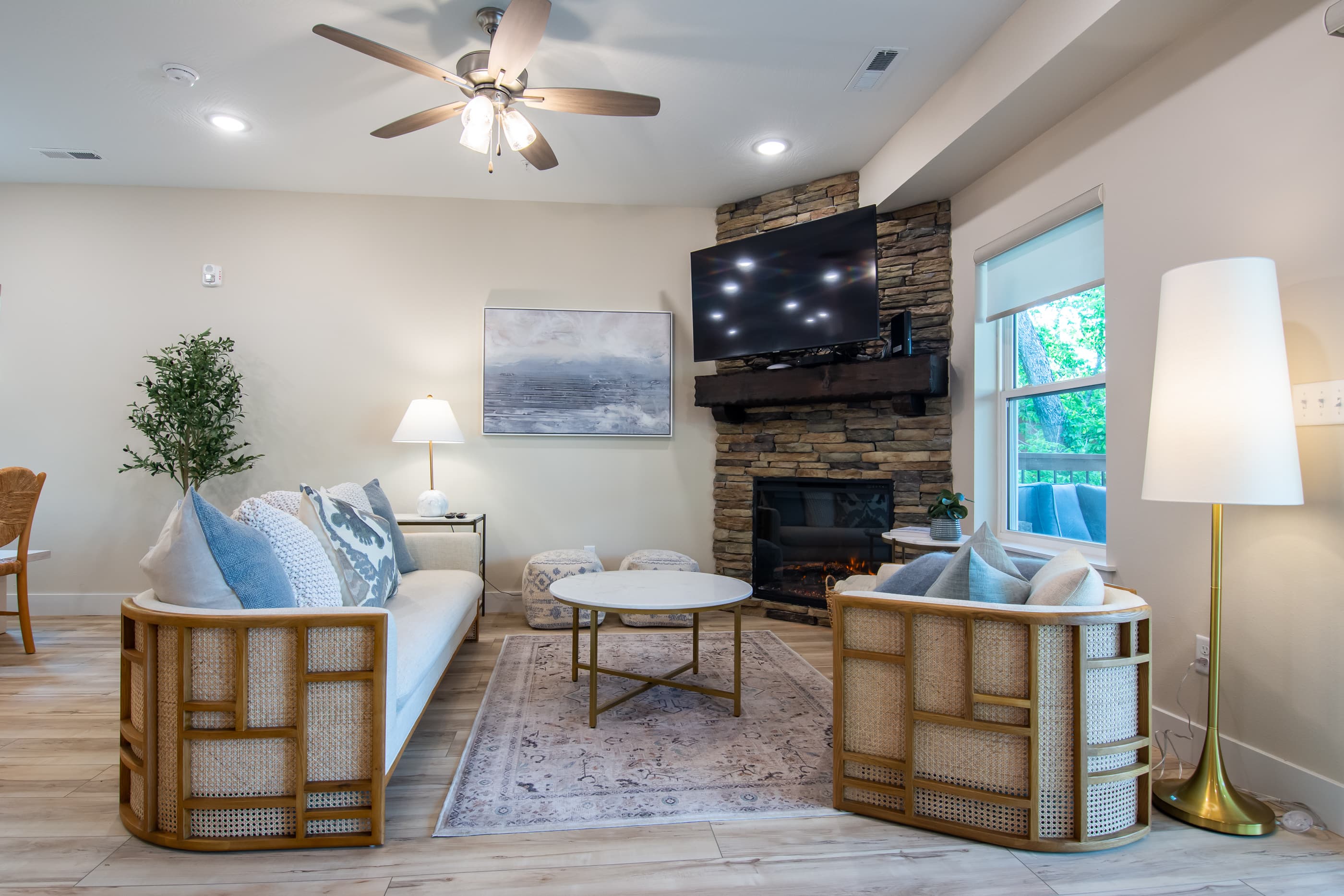 Main level great room with electric fireplace and abundant seating