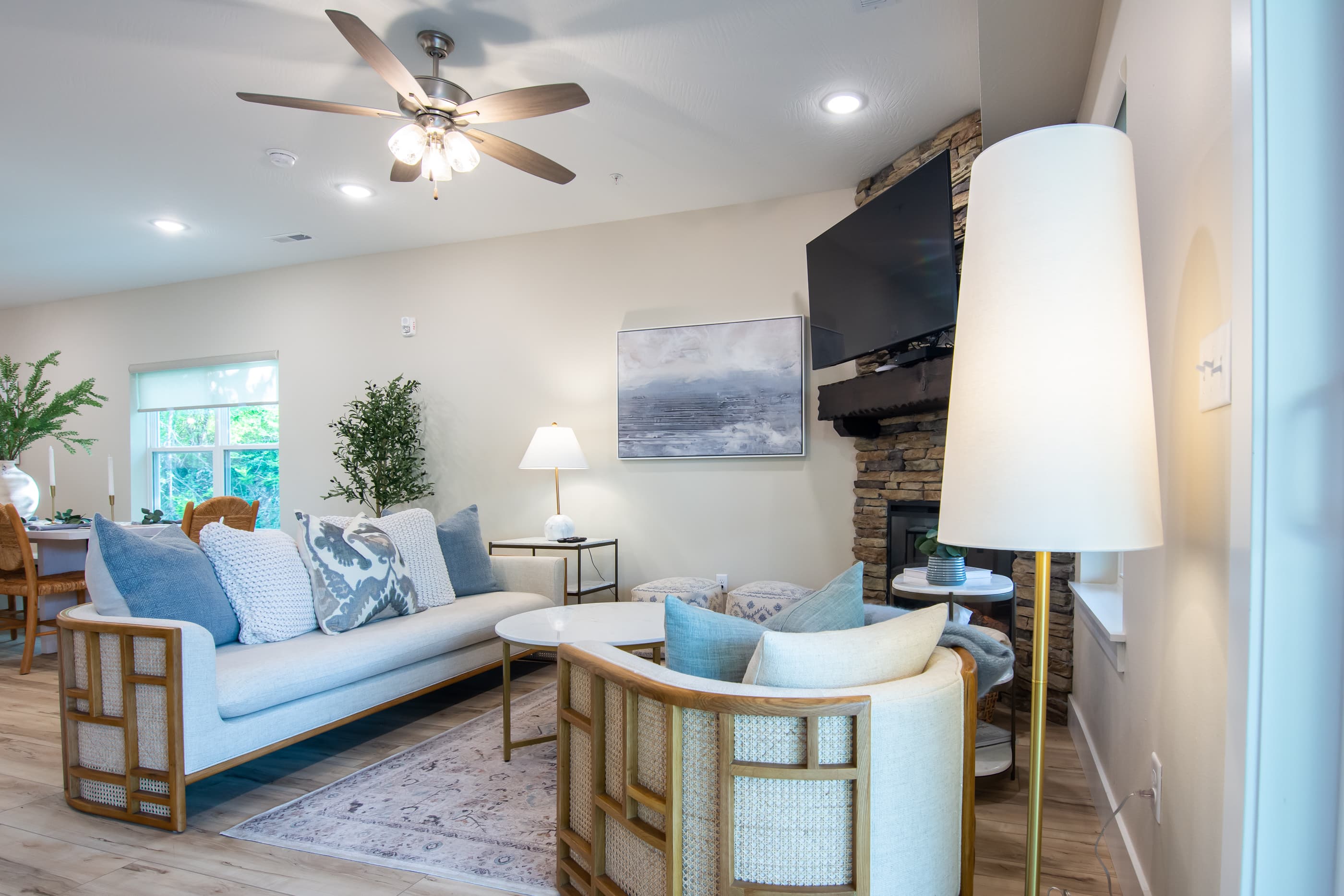 Main level great room with electric fireplace and abundant seating