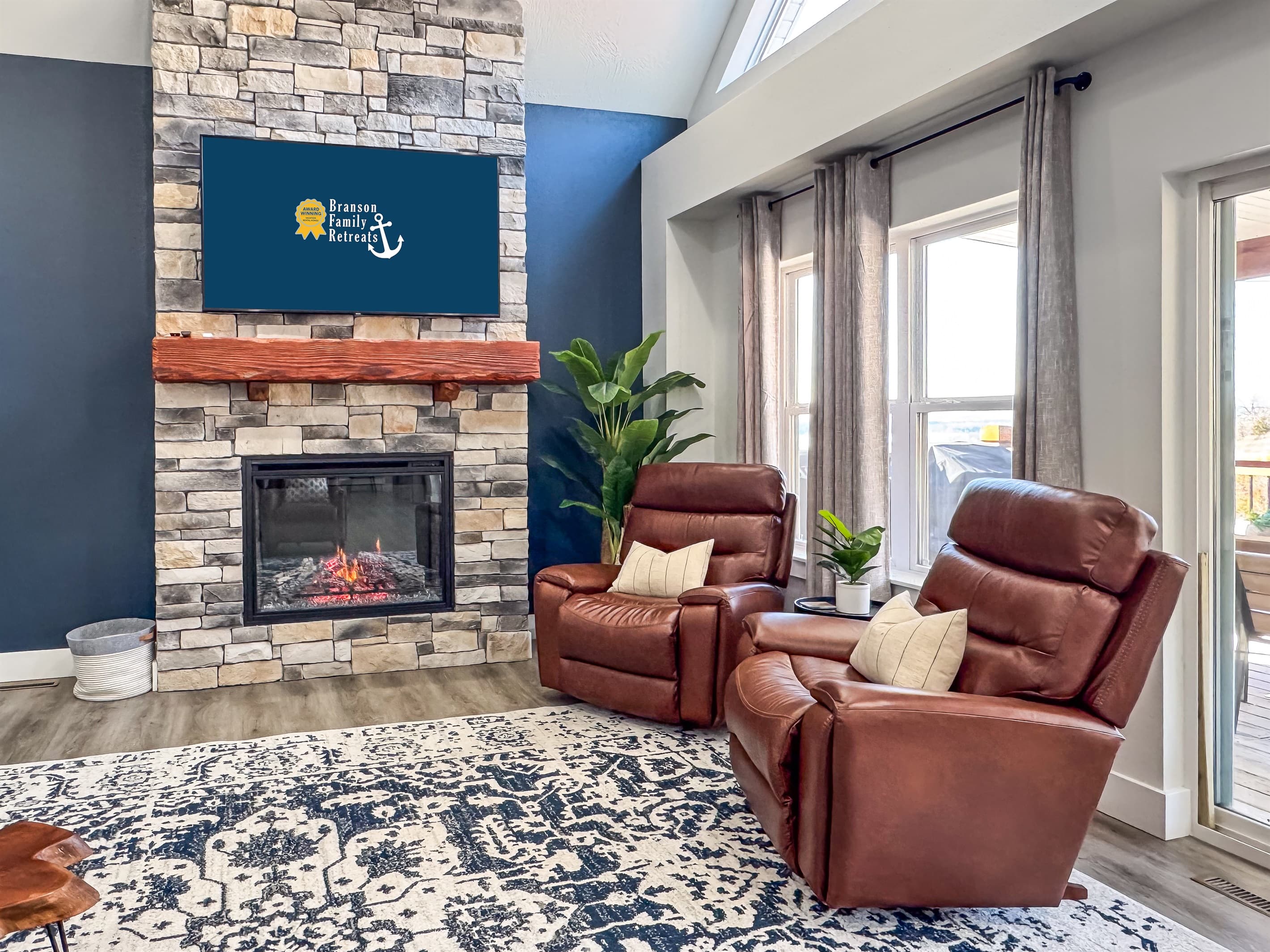 Two reclining chairs by the electric fireplace