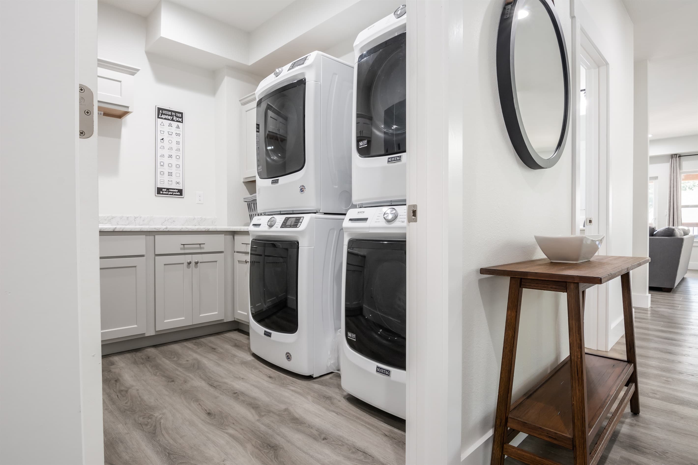 Two washer/dryer sets on the main level, third on the lower level