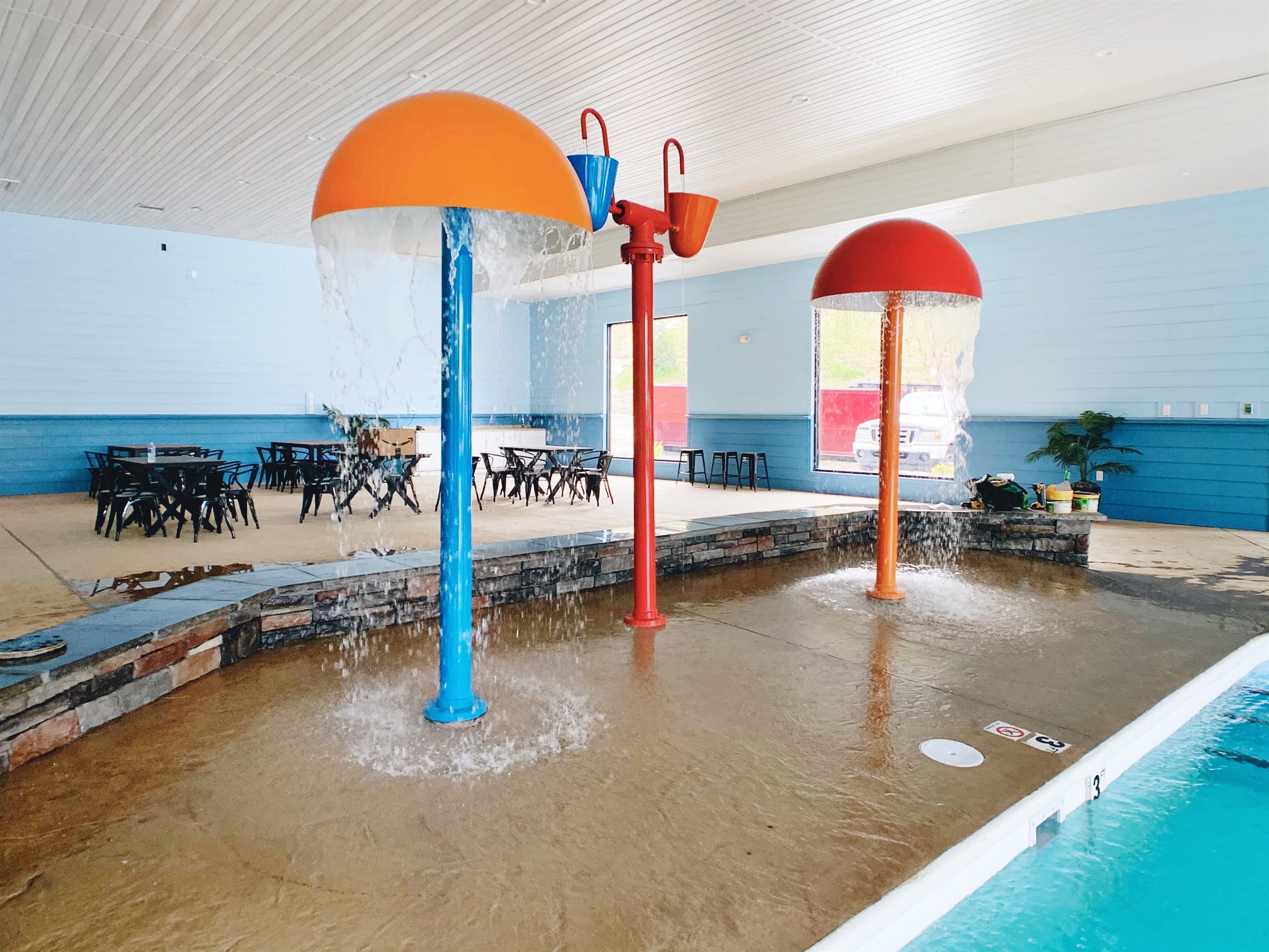 Indoor splash pad and seating to supervise