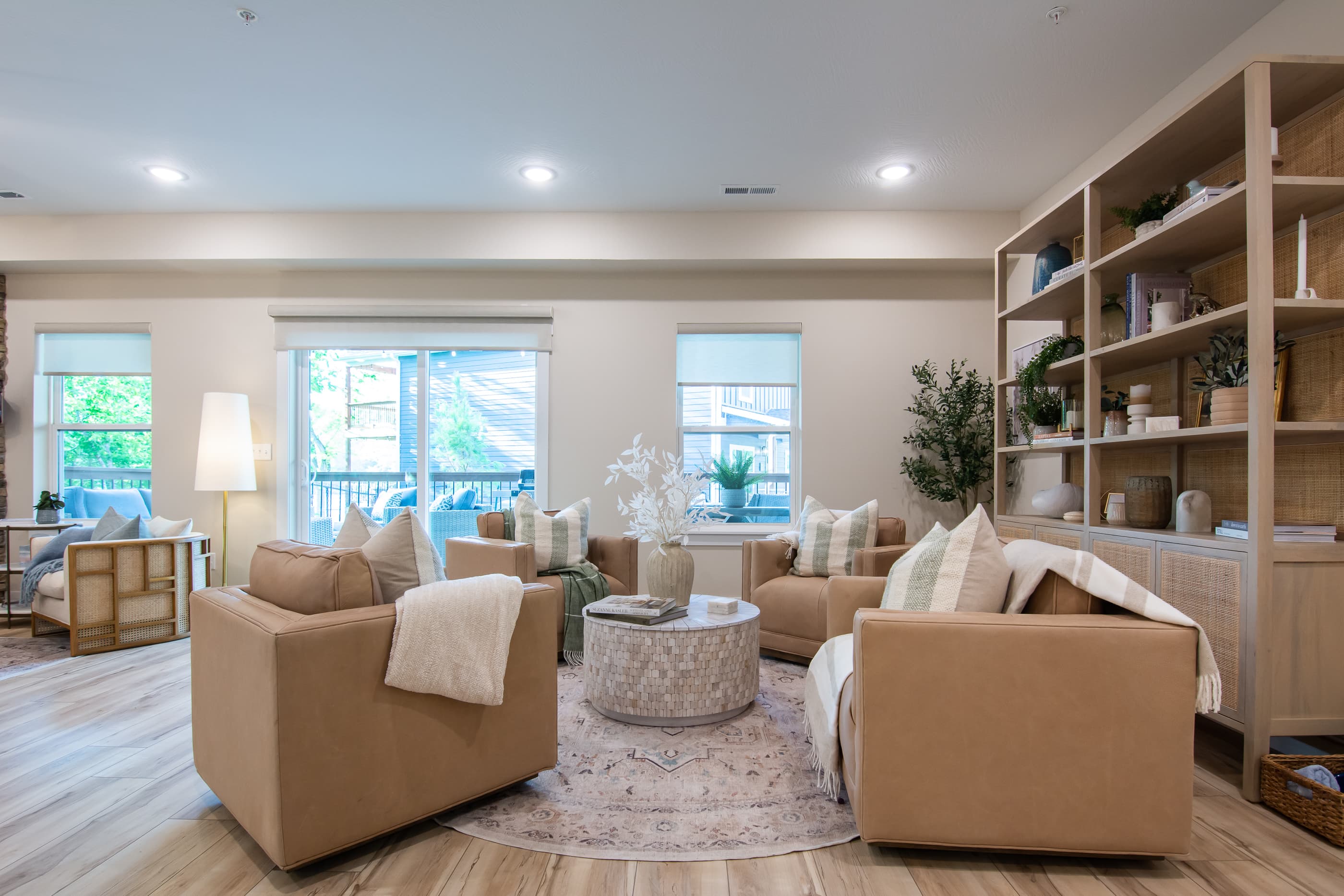 Main level great room seating area with access to lower level patio