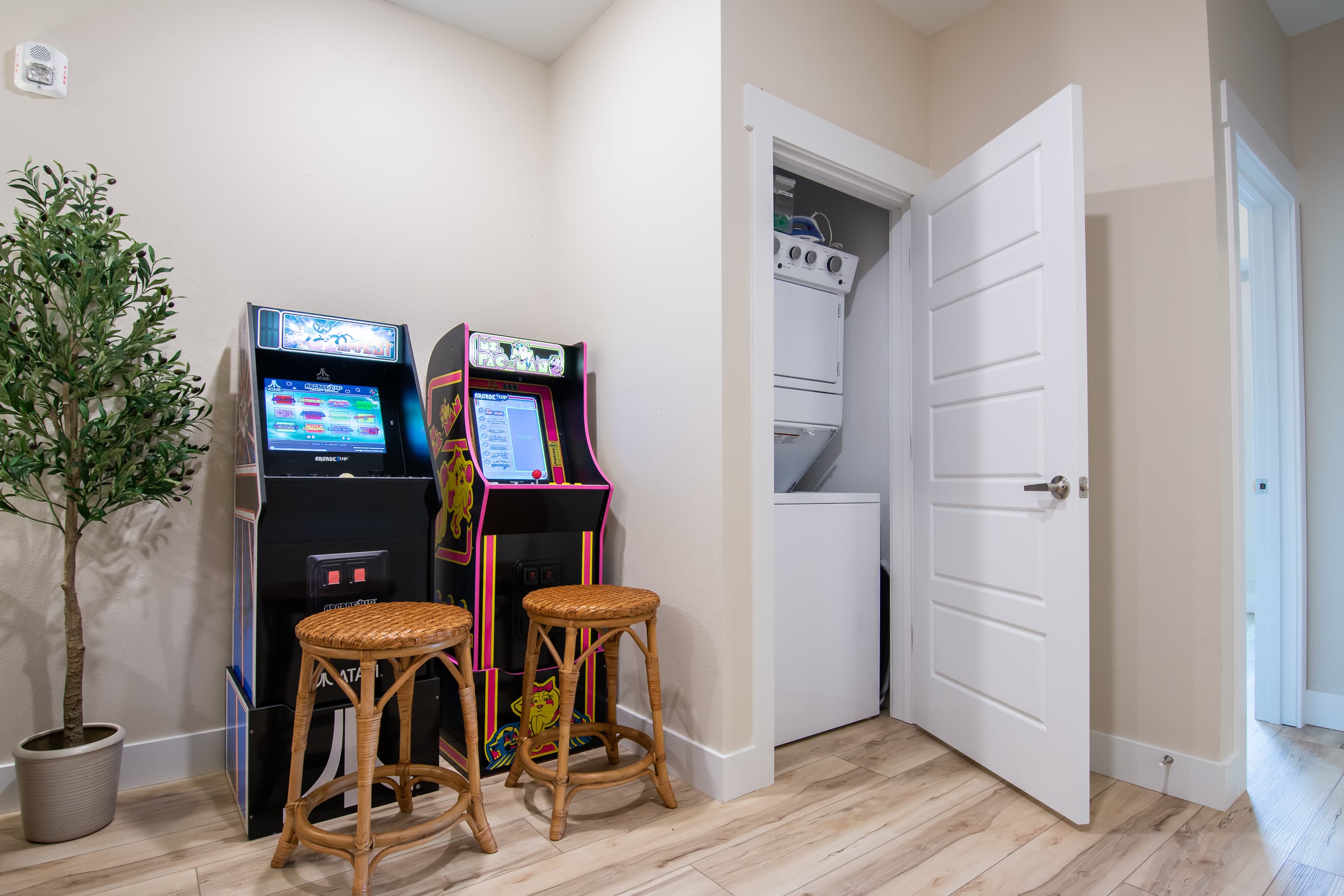 Upper level arcade game room and washer/dryer set