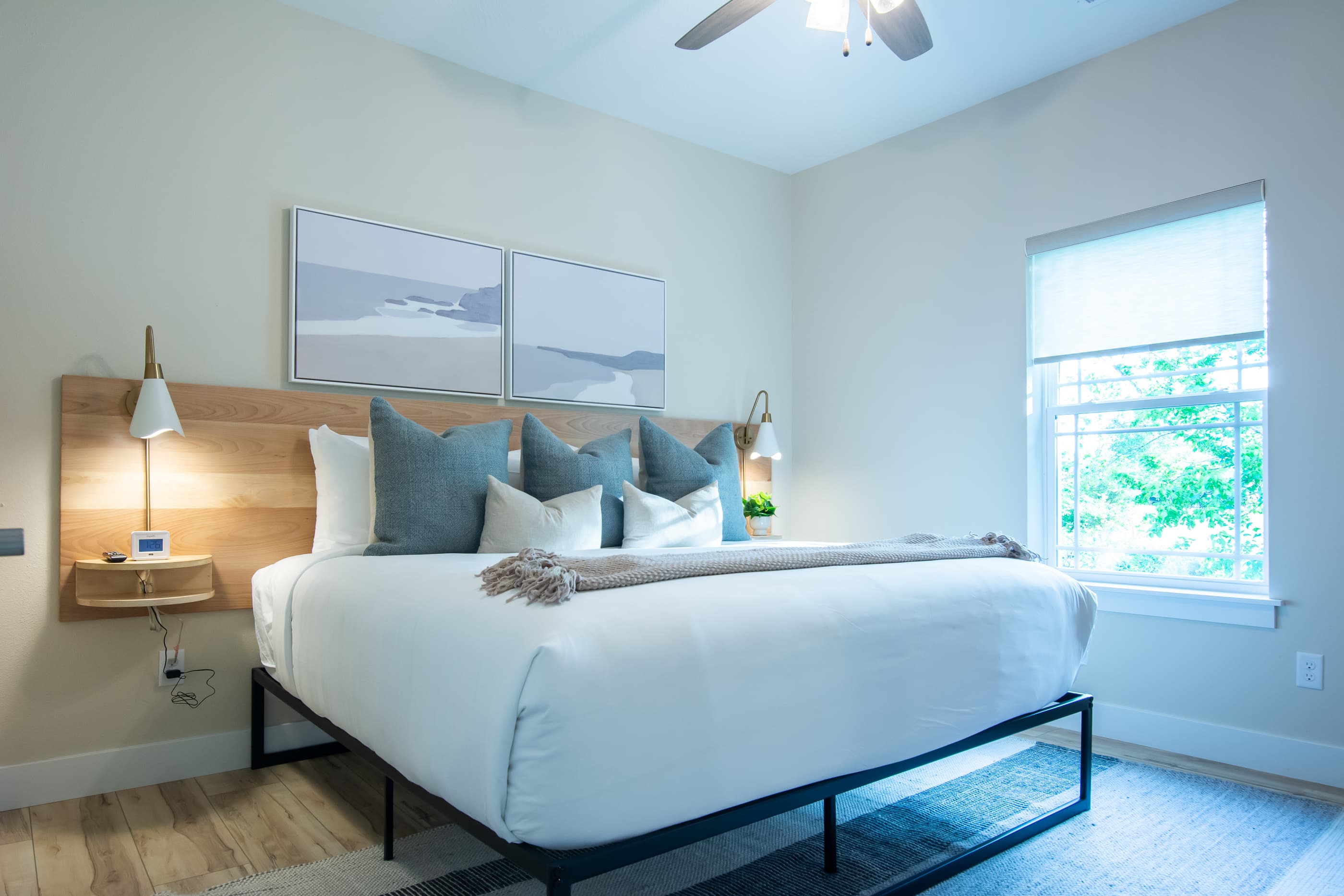 King bedroom with ample space around all sides of the bed