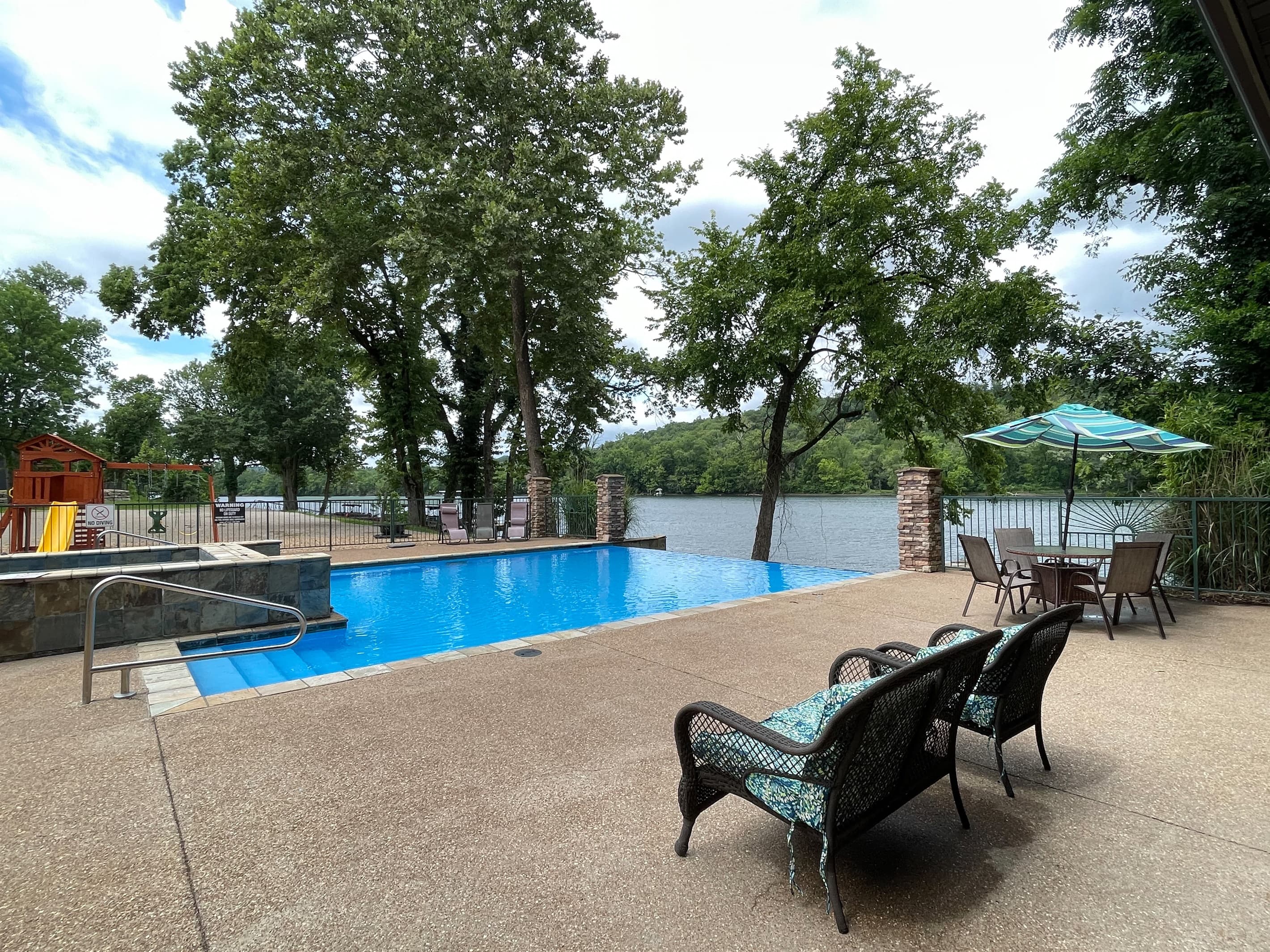 Neighborhood pool with gorgeous lake view and plenty of seating
