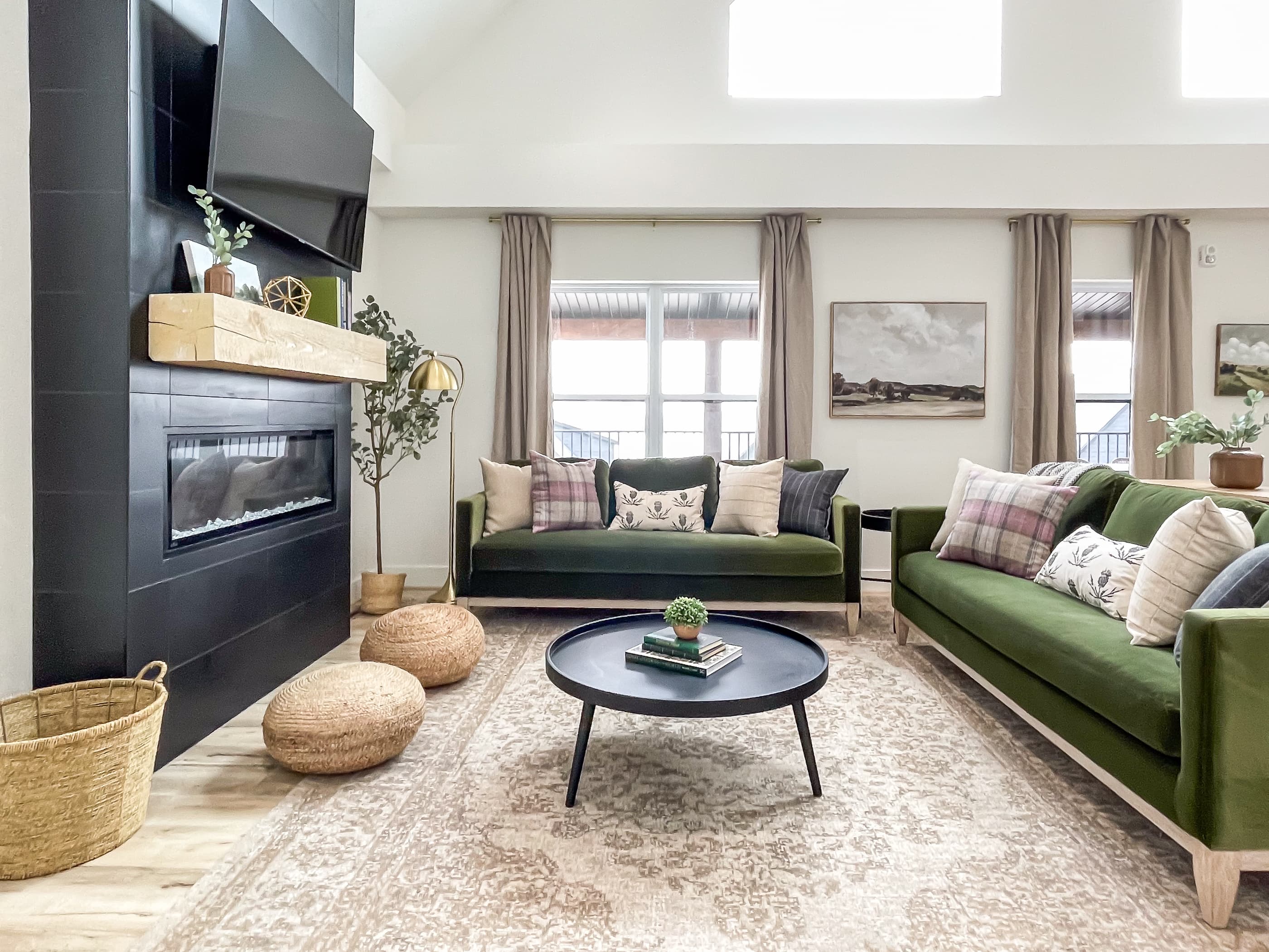 Bright and inviting main level great room with electric fireplace and TV