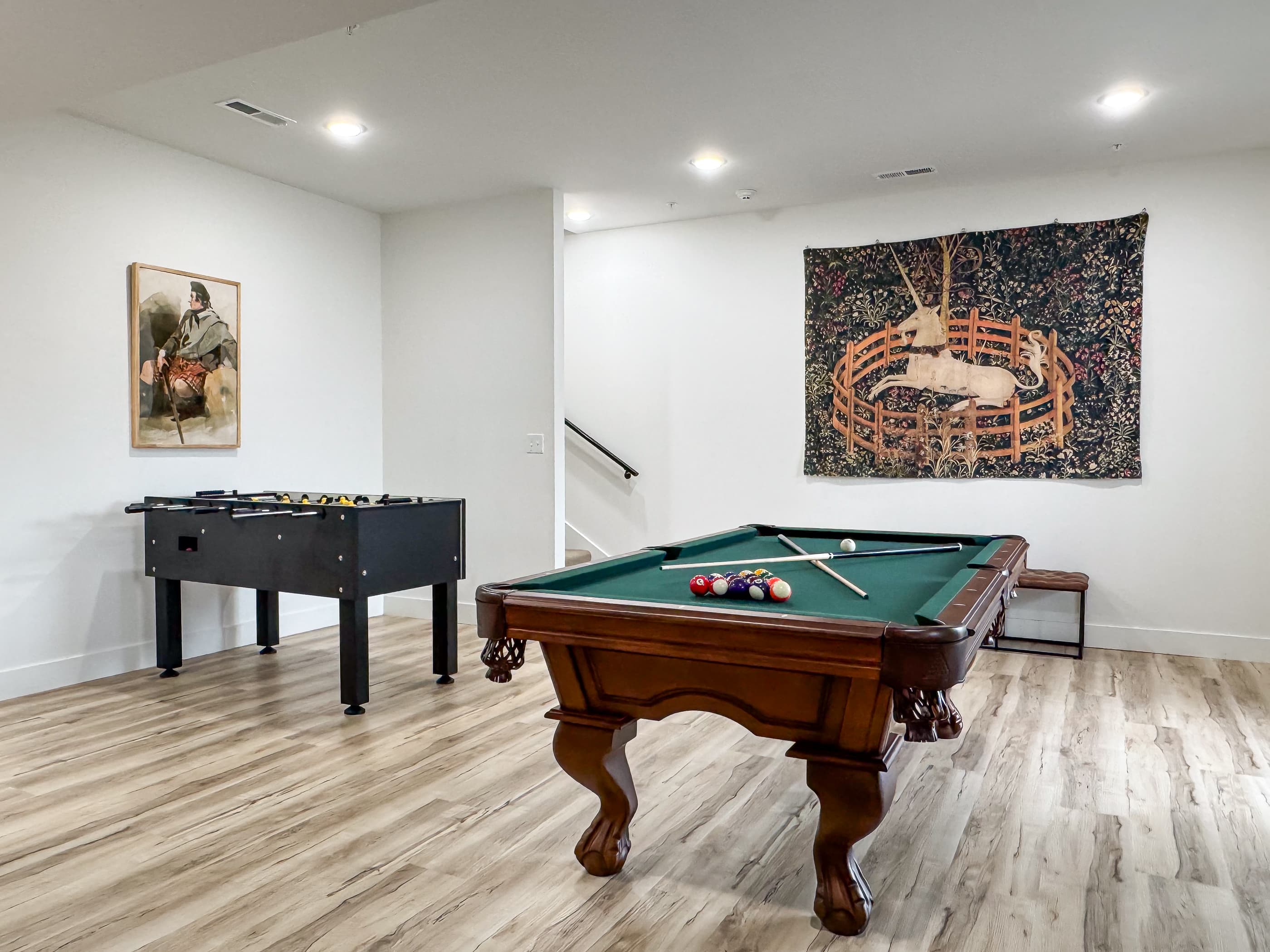 Lower level game room with pool table and foosball