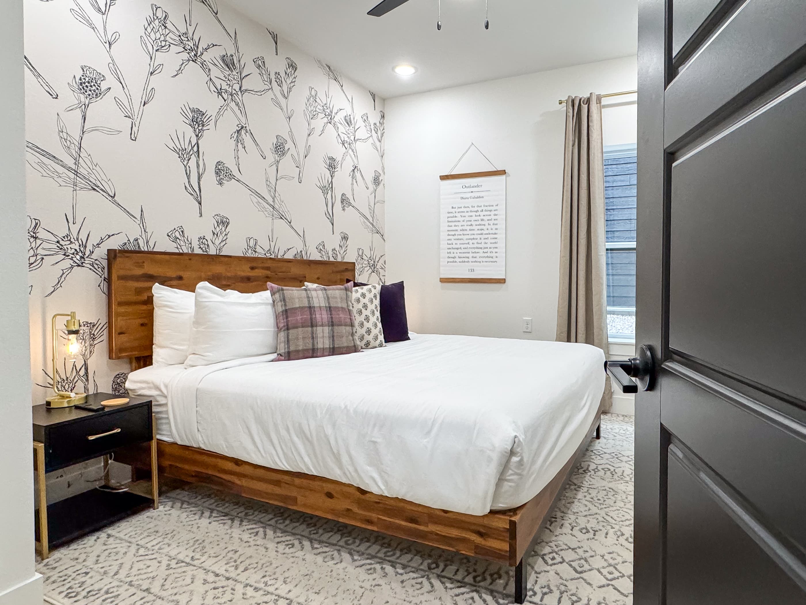 Lower level bedroom with large king bed and en suite bathroom