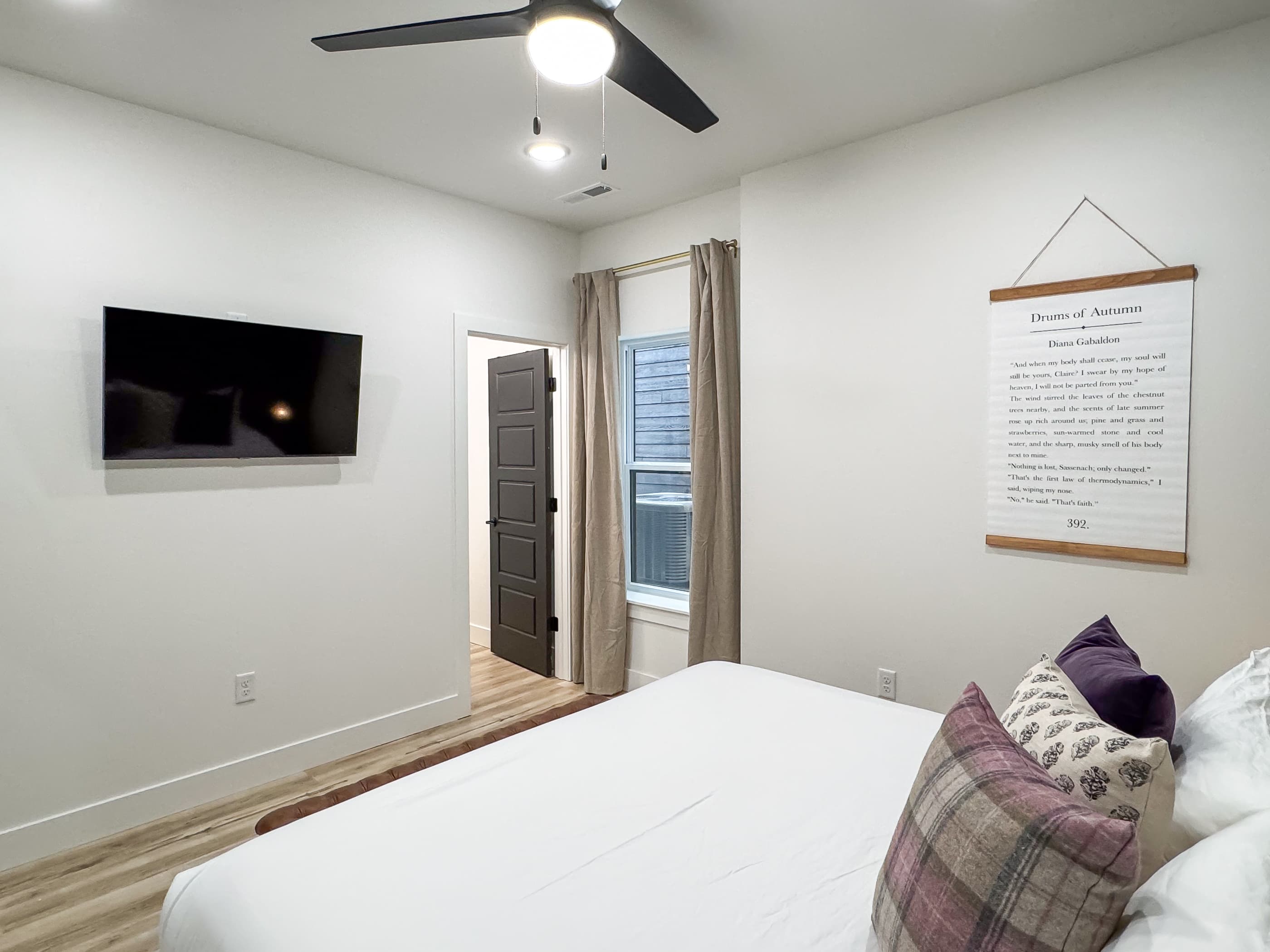 Lower level bedroom with large king bed and en suite bathroom