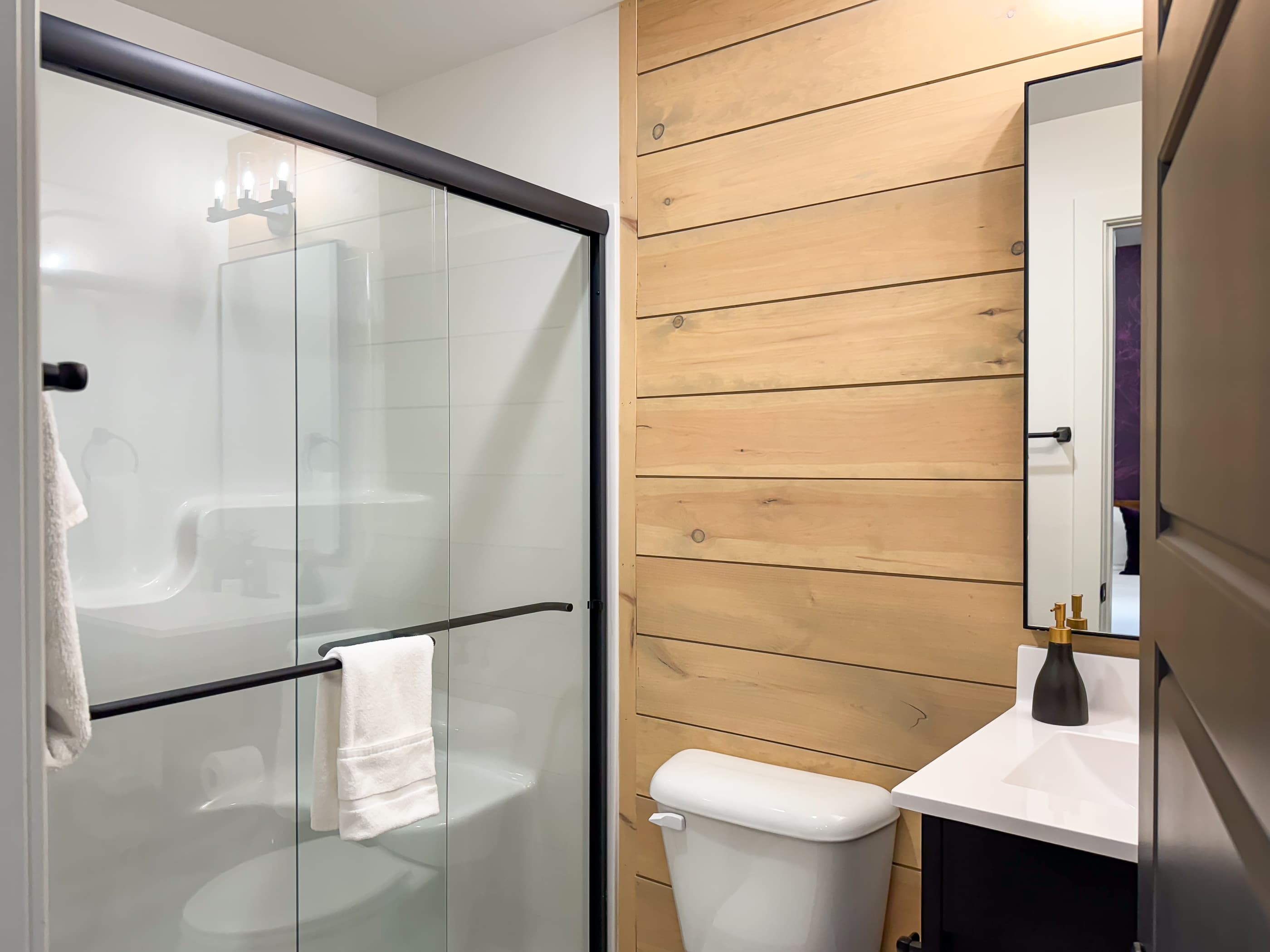 Lower level en suite bathroom with shower and built in seat