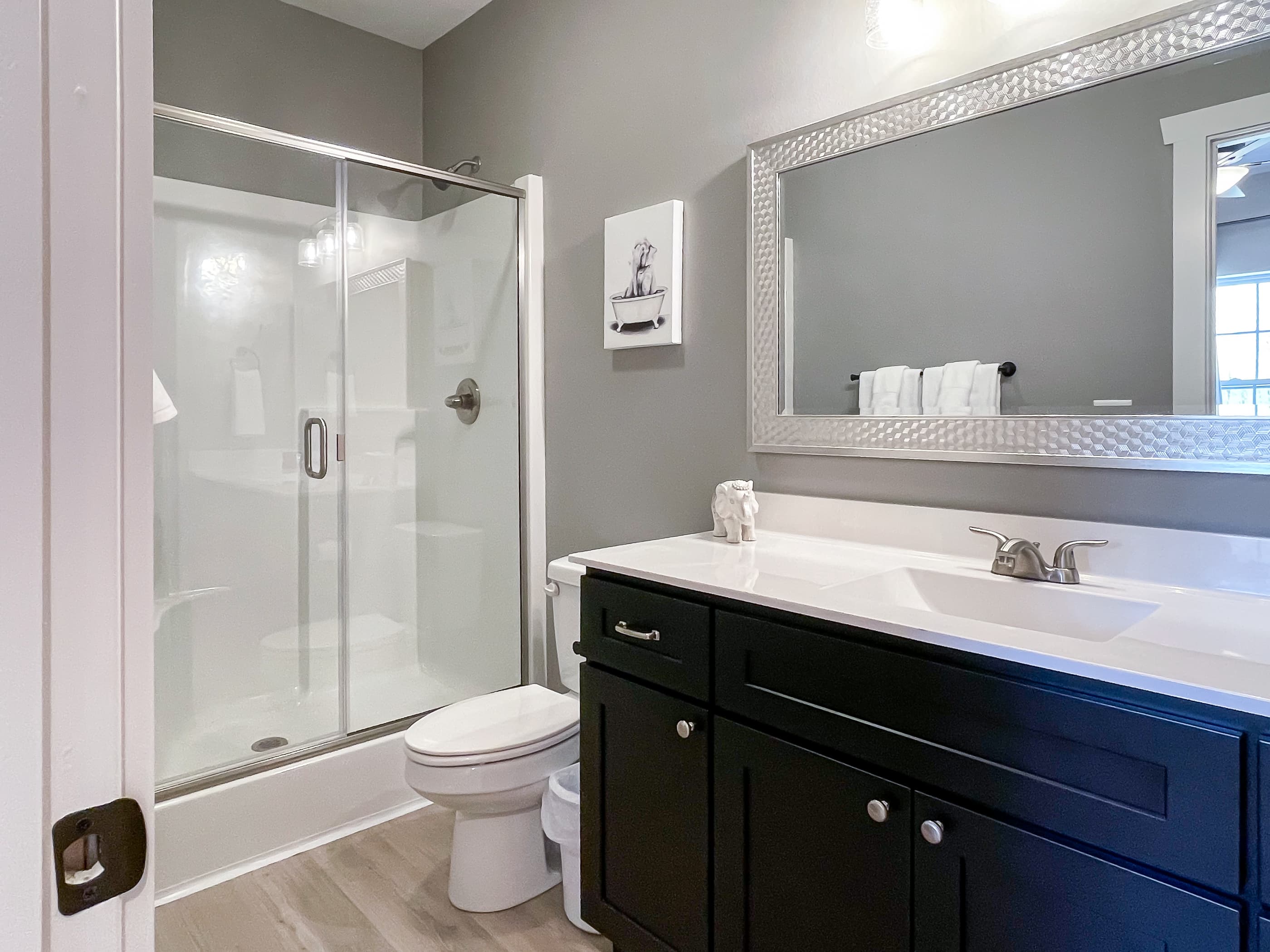 Bedroom 3 ensuite bathroom with step in shower and built in shower seat