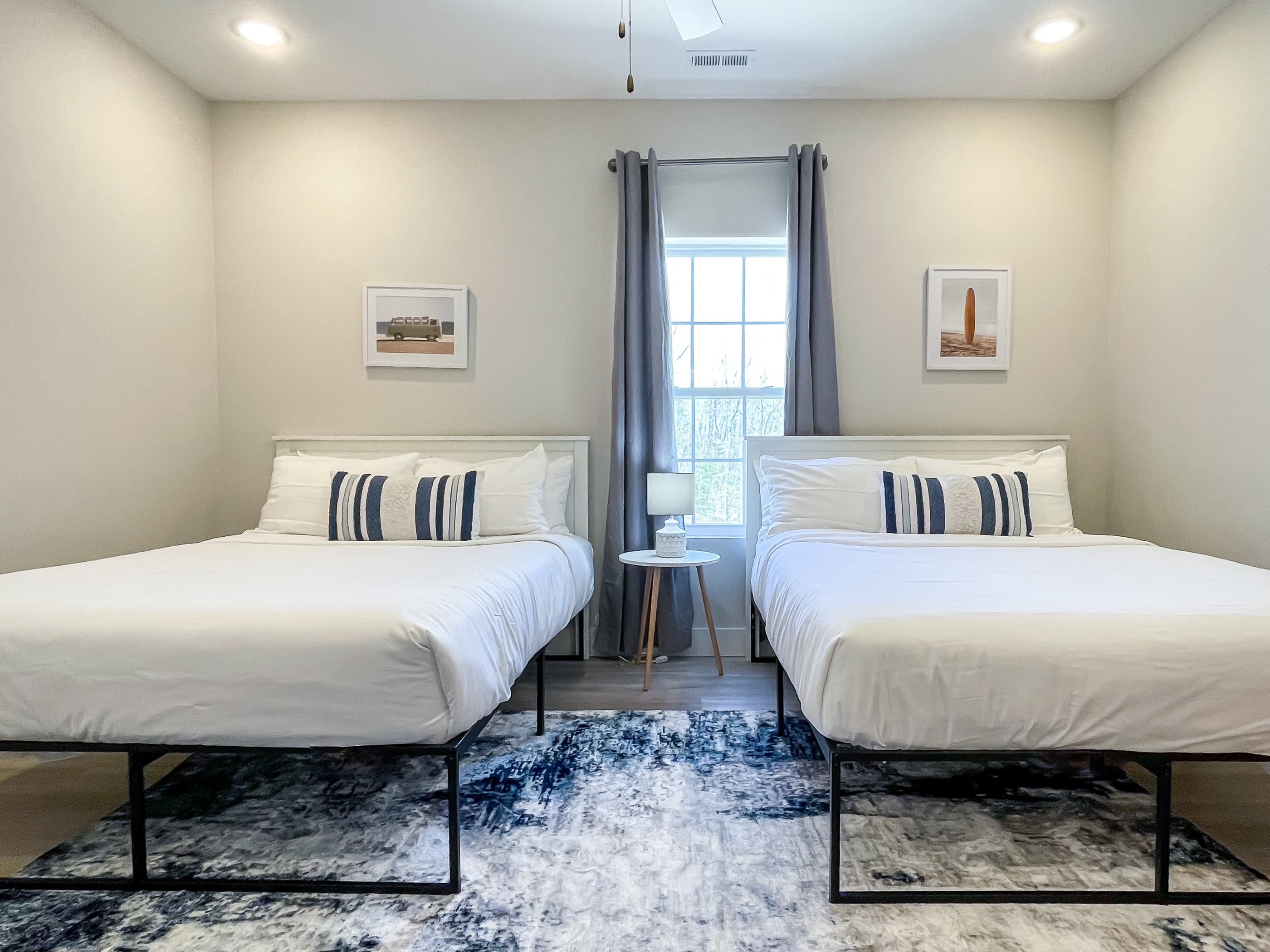 Bedroom 6 with two (2) queen size beds, en suite bathroom, and TV