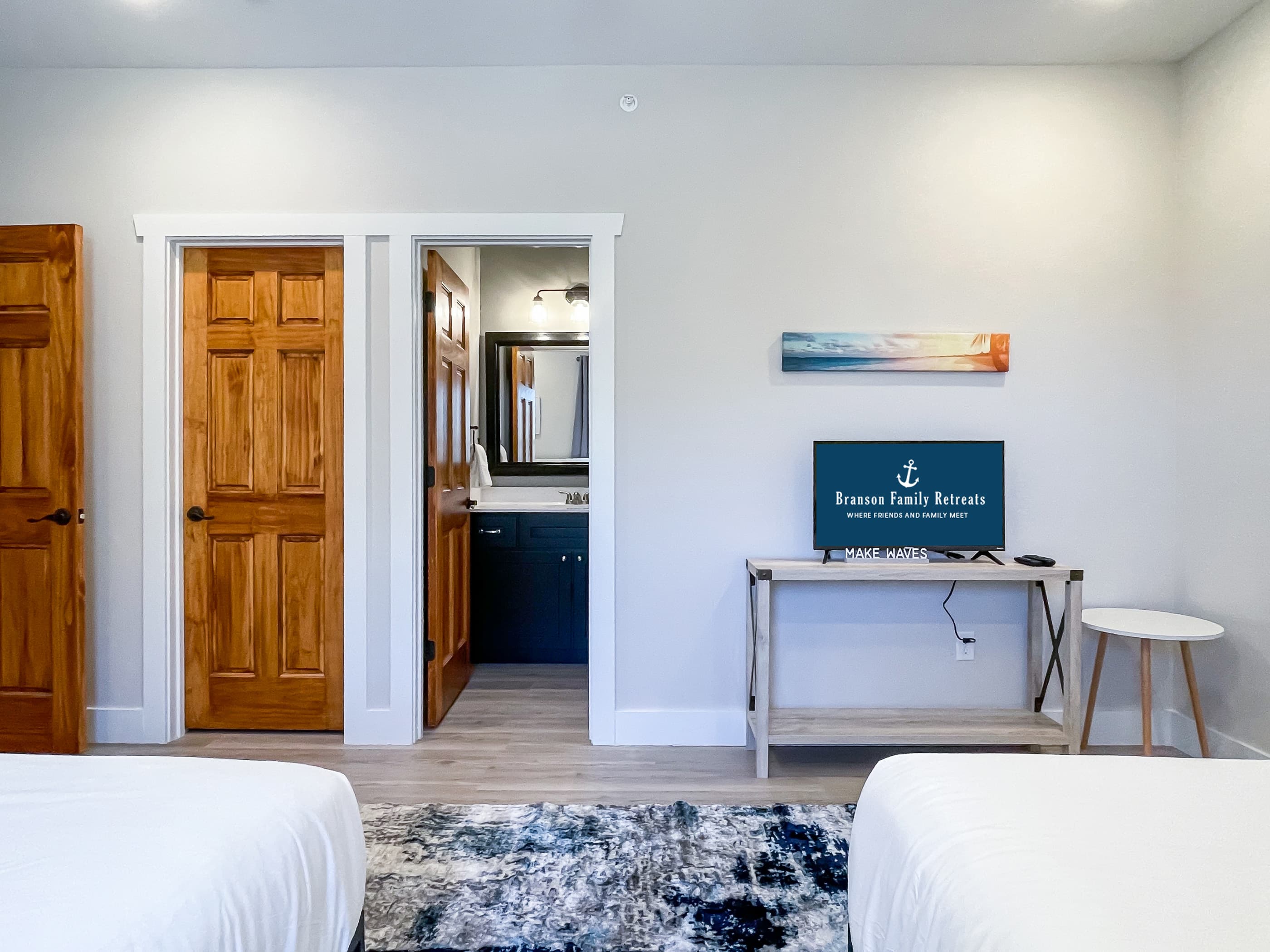 Bedroom 6 with (2) Queen beds and media center with TV, large closet and en suite bathroom