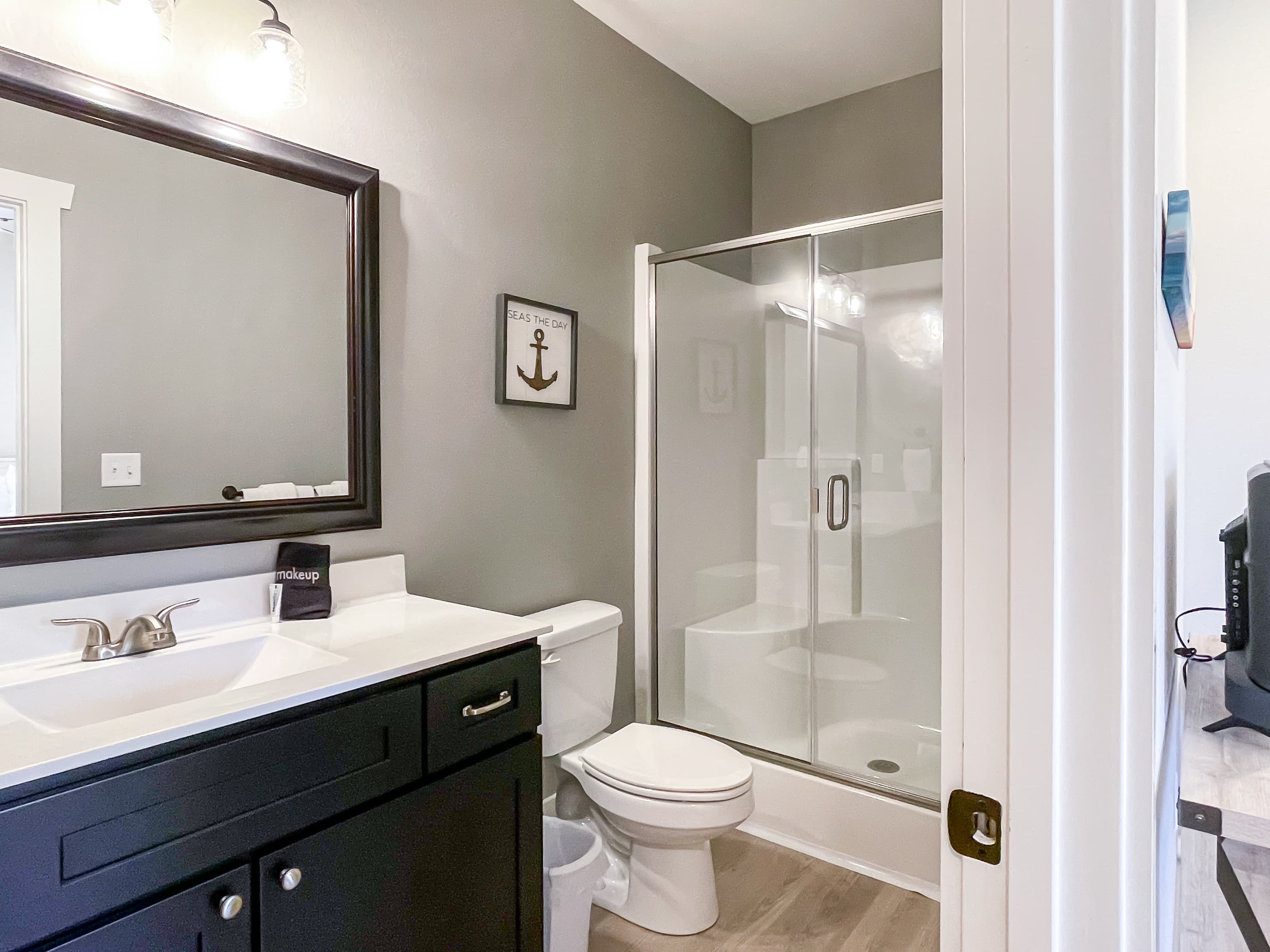 Bedroom 6 en suite bathroom with step in shower and shower seat