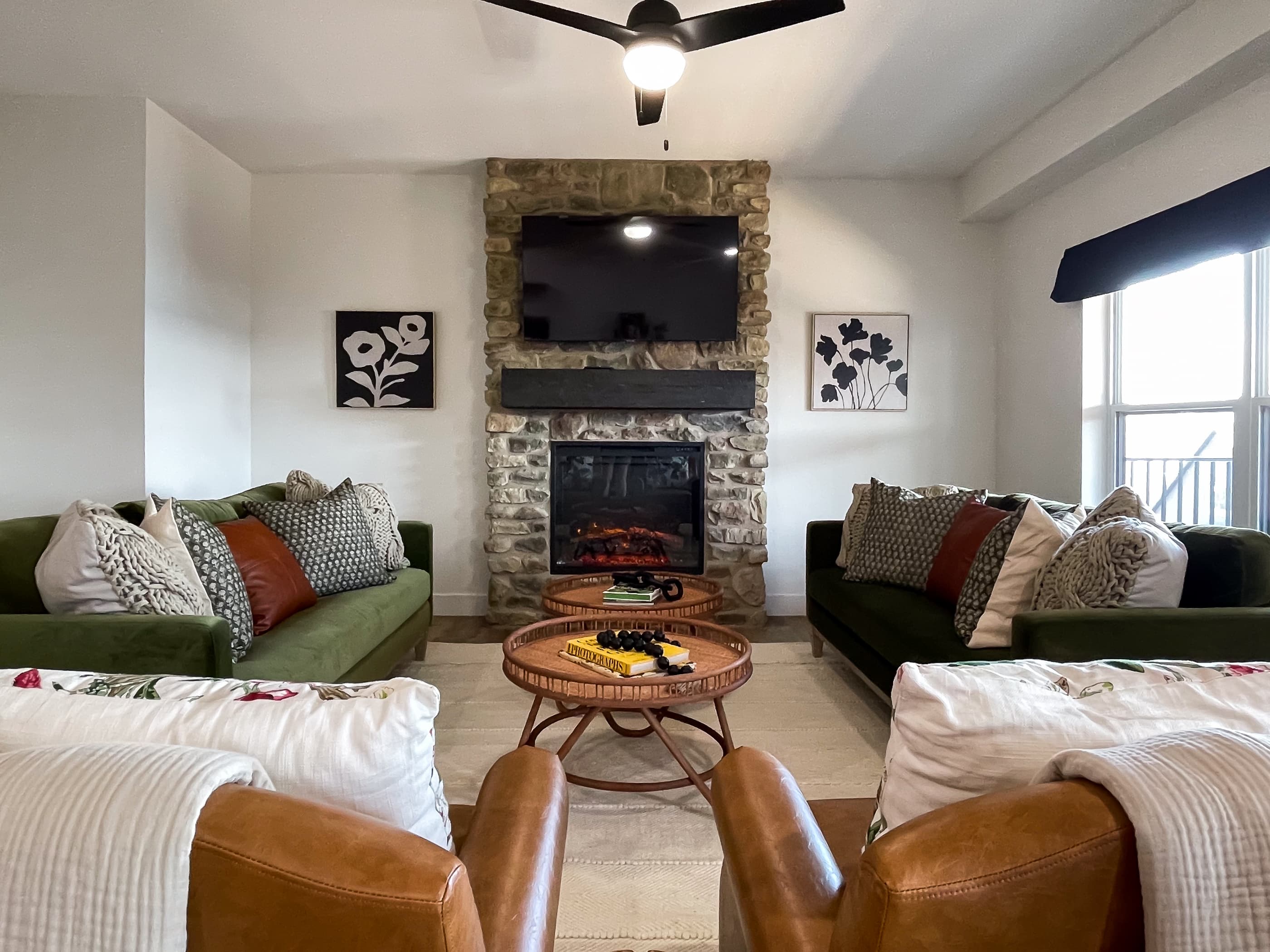 Living room with Tv, electric fireplace, and many options to sit at