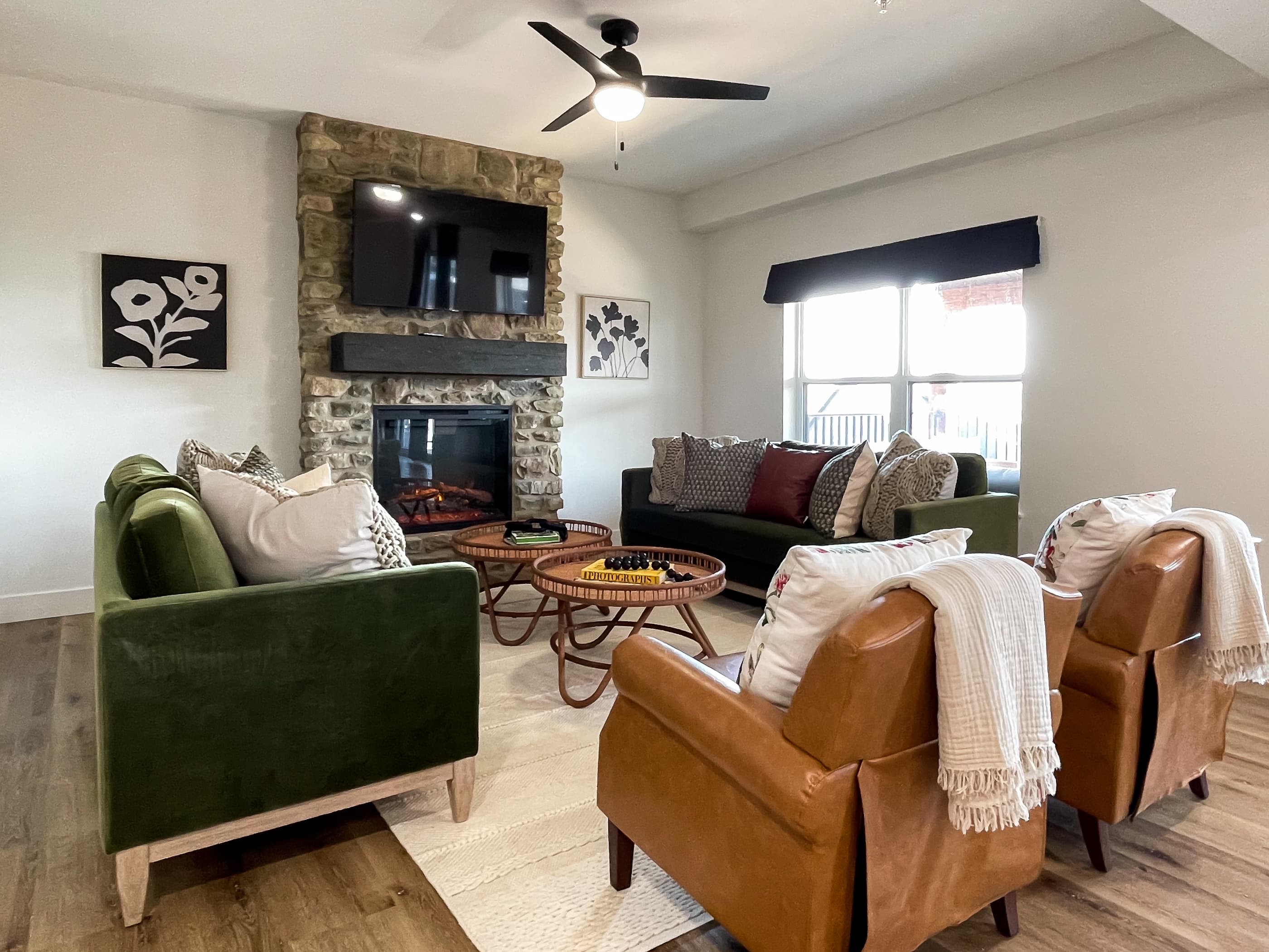 Living room with two couches and 2 leather seats