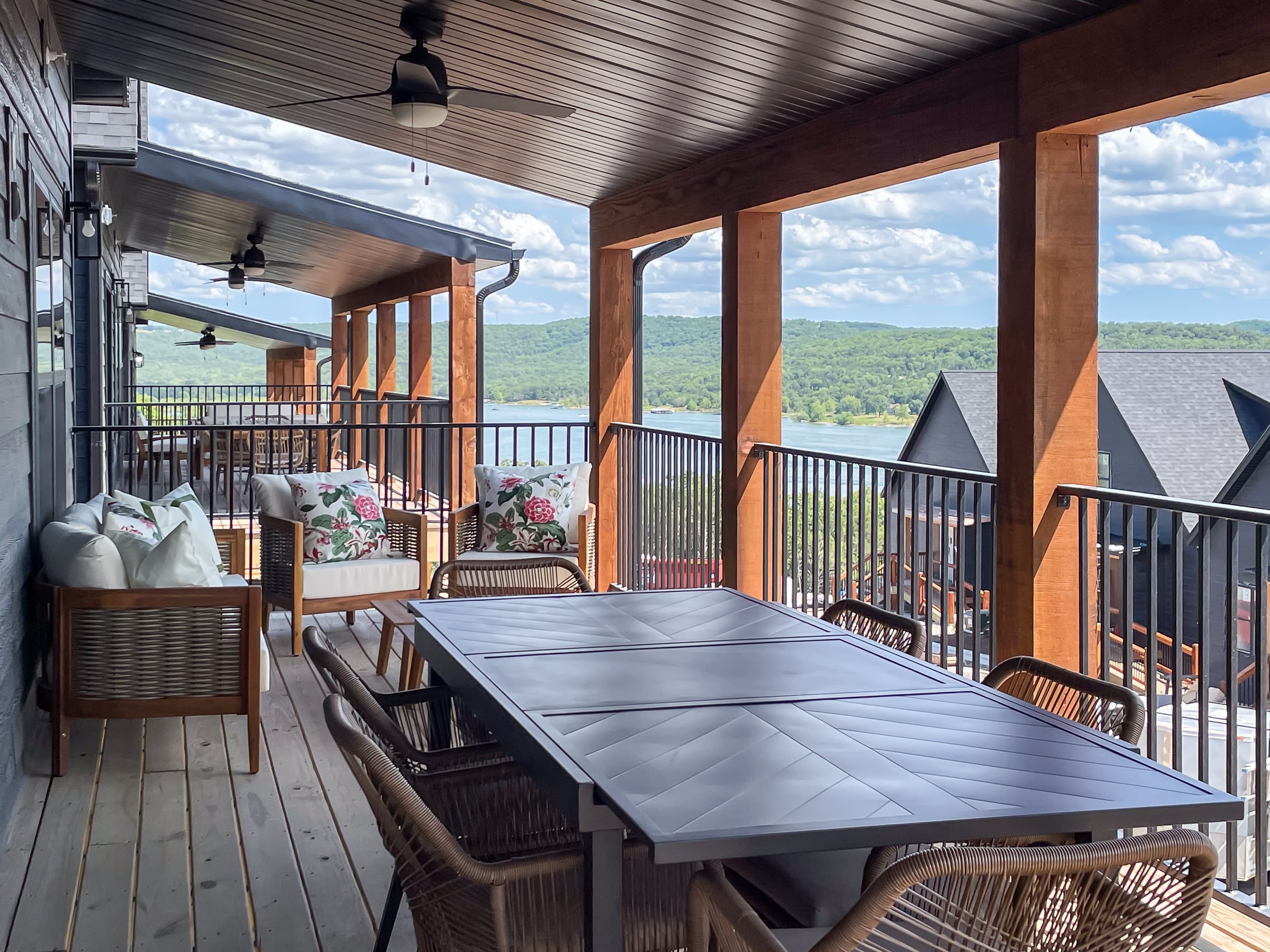 Main level deck to relax with cushion seating and outdoor dining table area