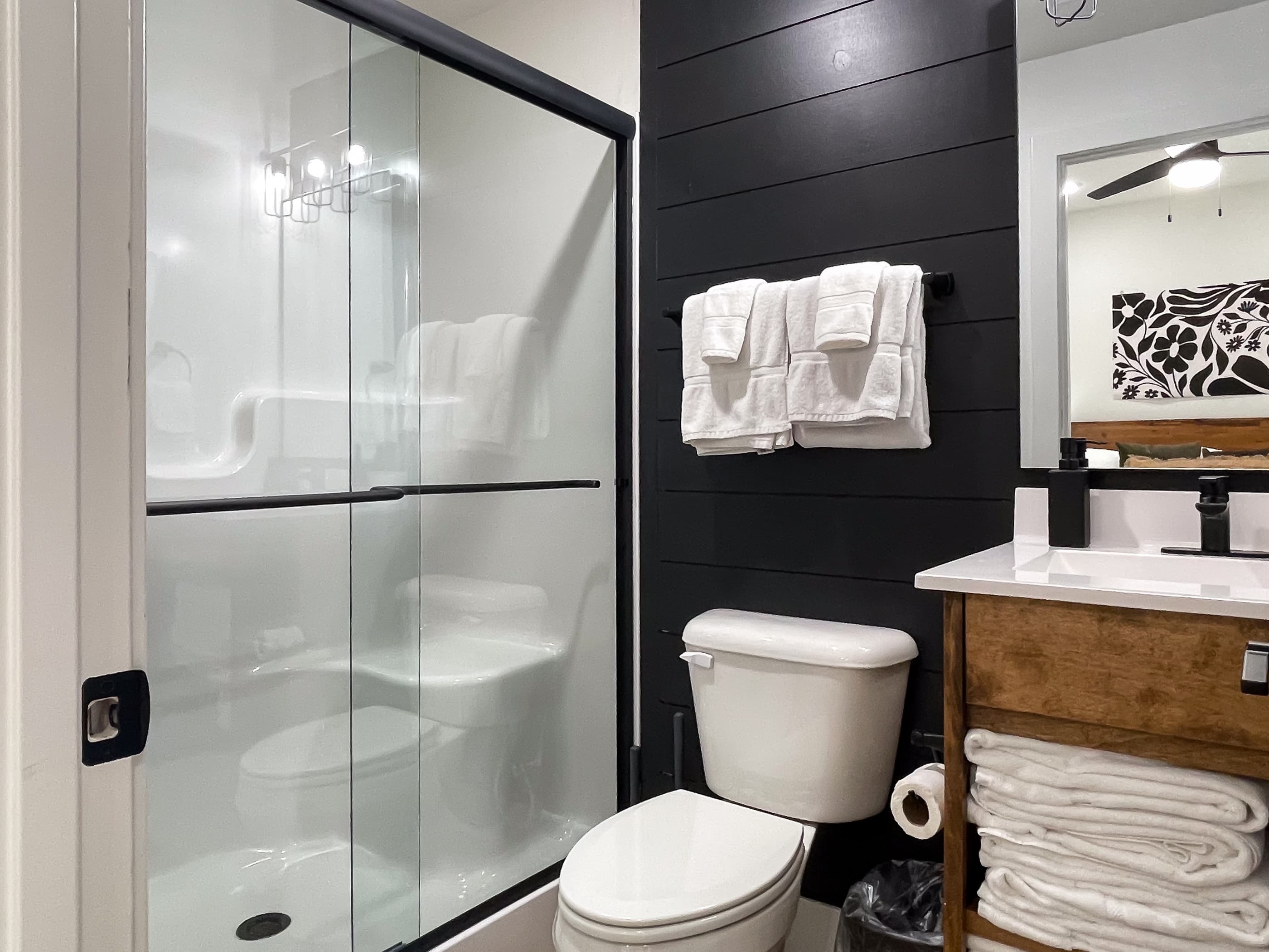 Bedroom 3: En-suite low curb shower, toilet, and vanity