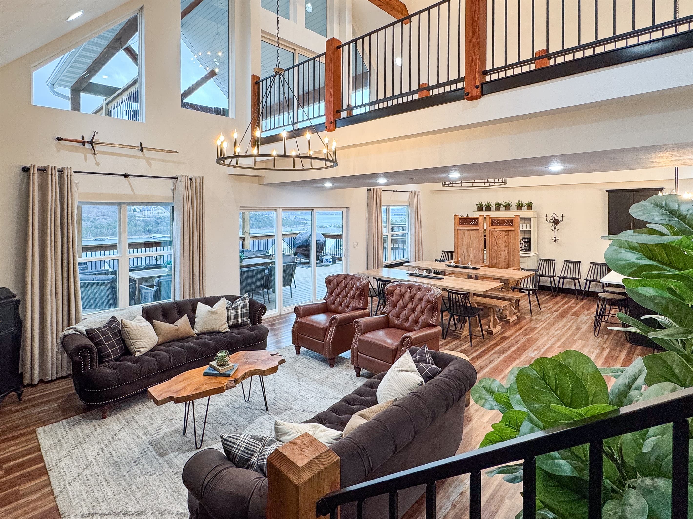 Main level great room with open concept, abundant seating, and lake views