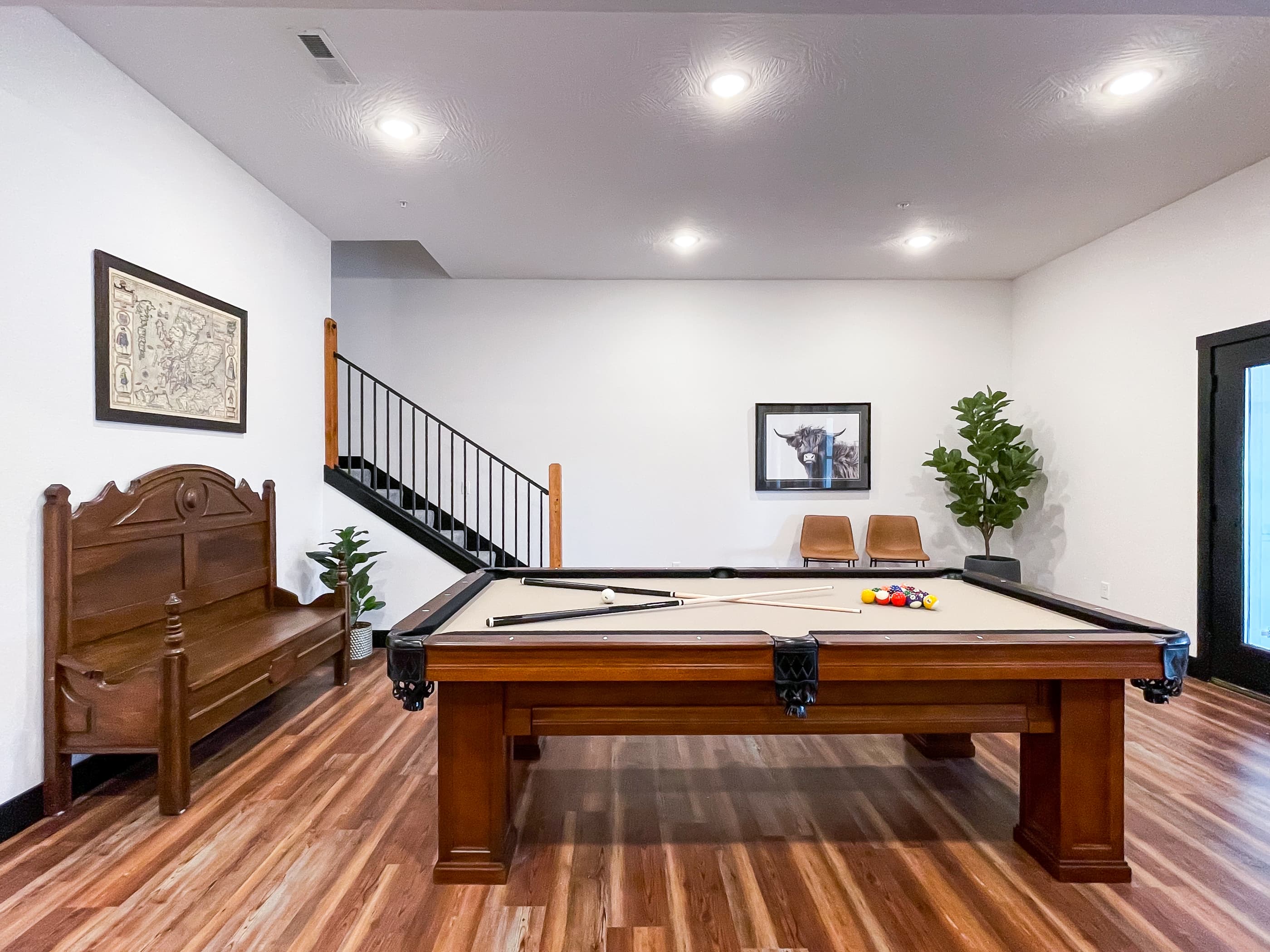 Lower level game room with pool table and pool room access