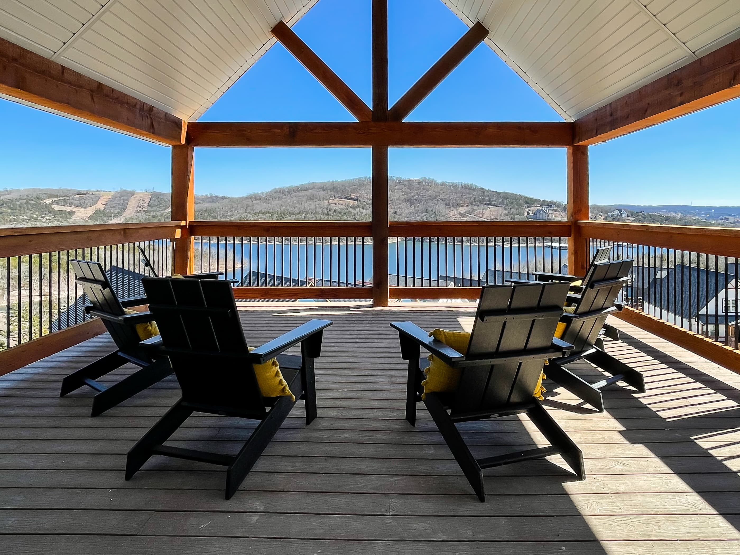 Covered upper level deck with adirondack chairs