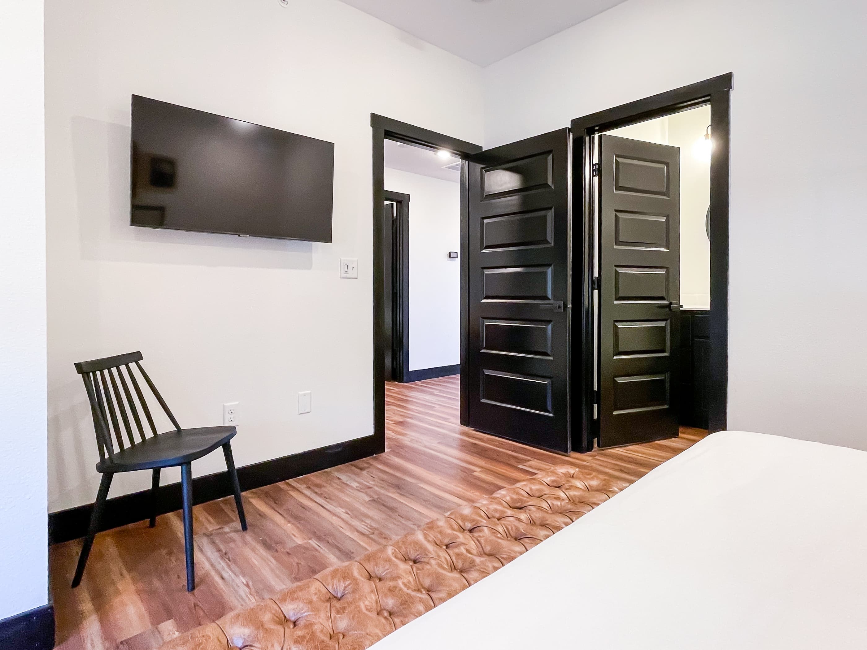 Main level spacious room with TV and extra seating