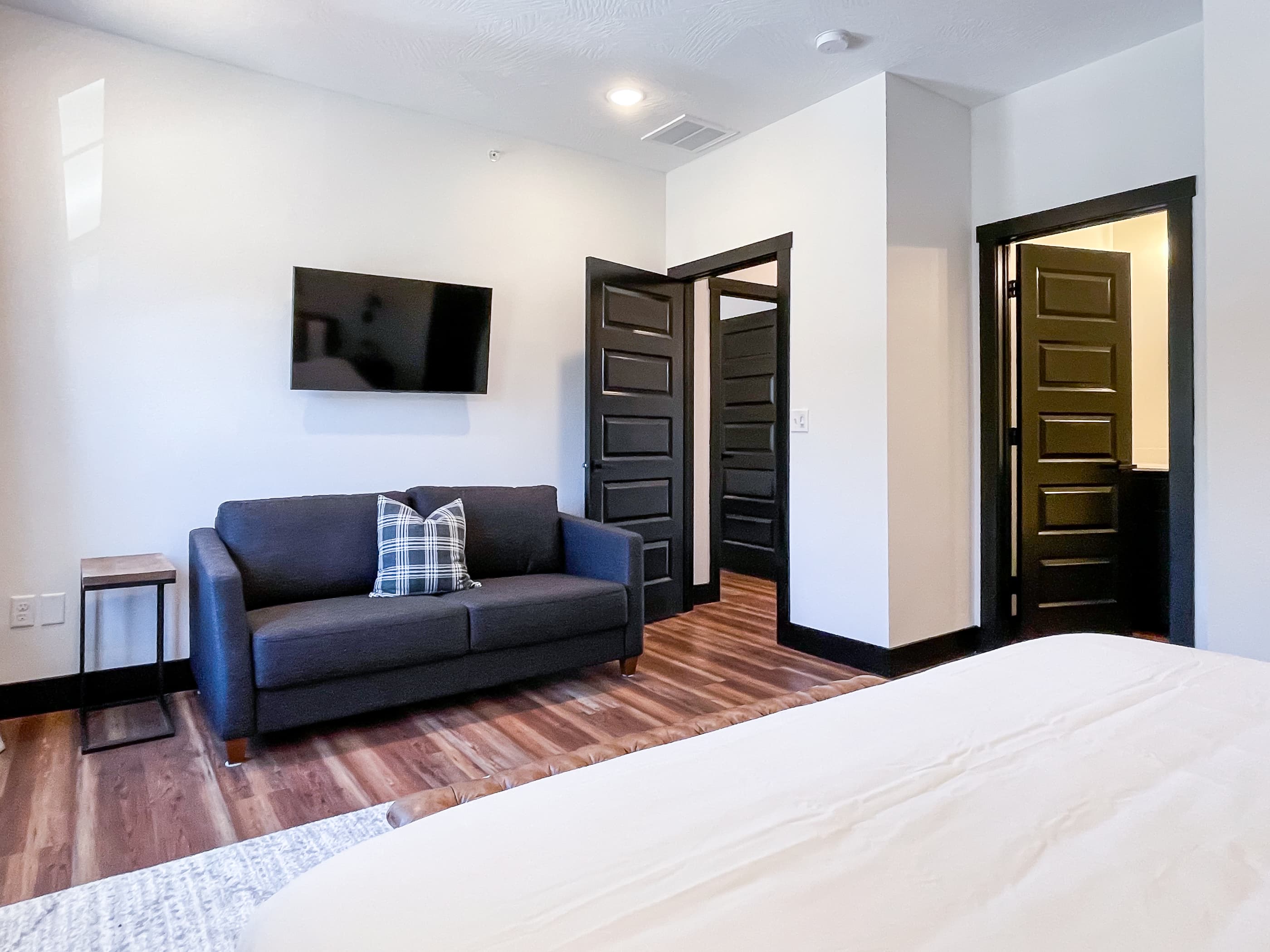 Upper level bedroom with queen sleeper sofa and en suite bathroom