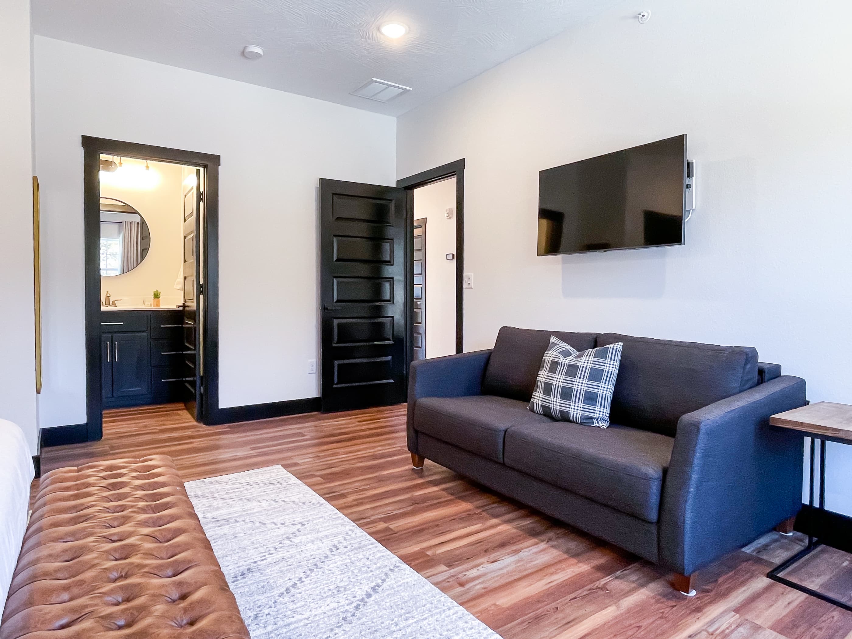 Upper level bedroom king bed with queen sleeper sofa and en suite bathroom