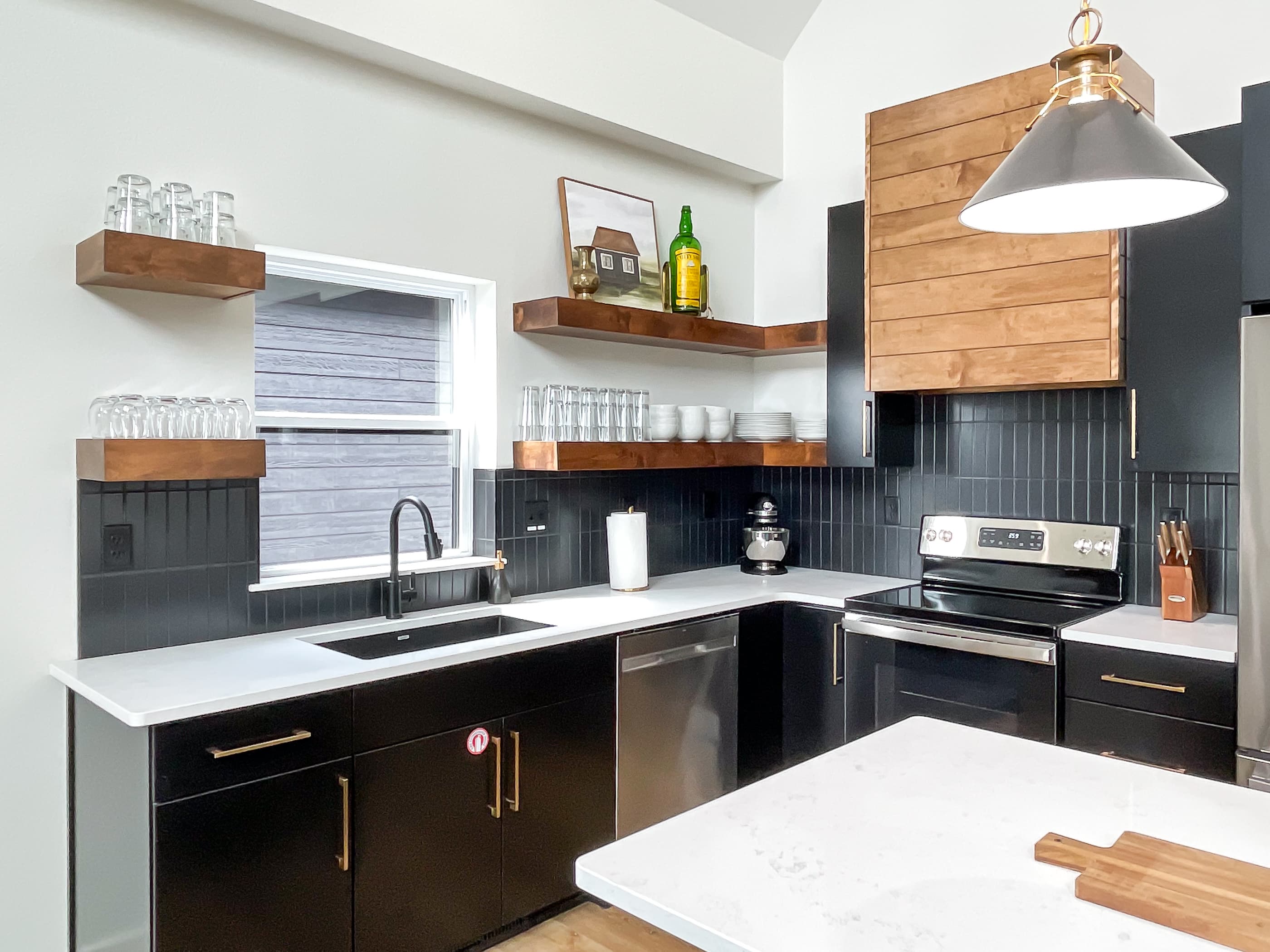 Full sized spacious kitchen with large island, dishwasher and stove