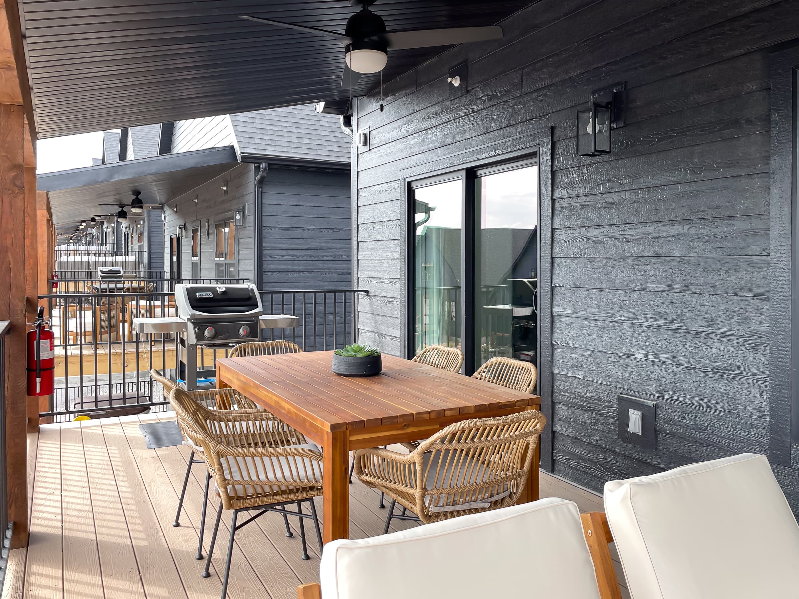 Dining set and gas grill on deck with main level access