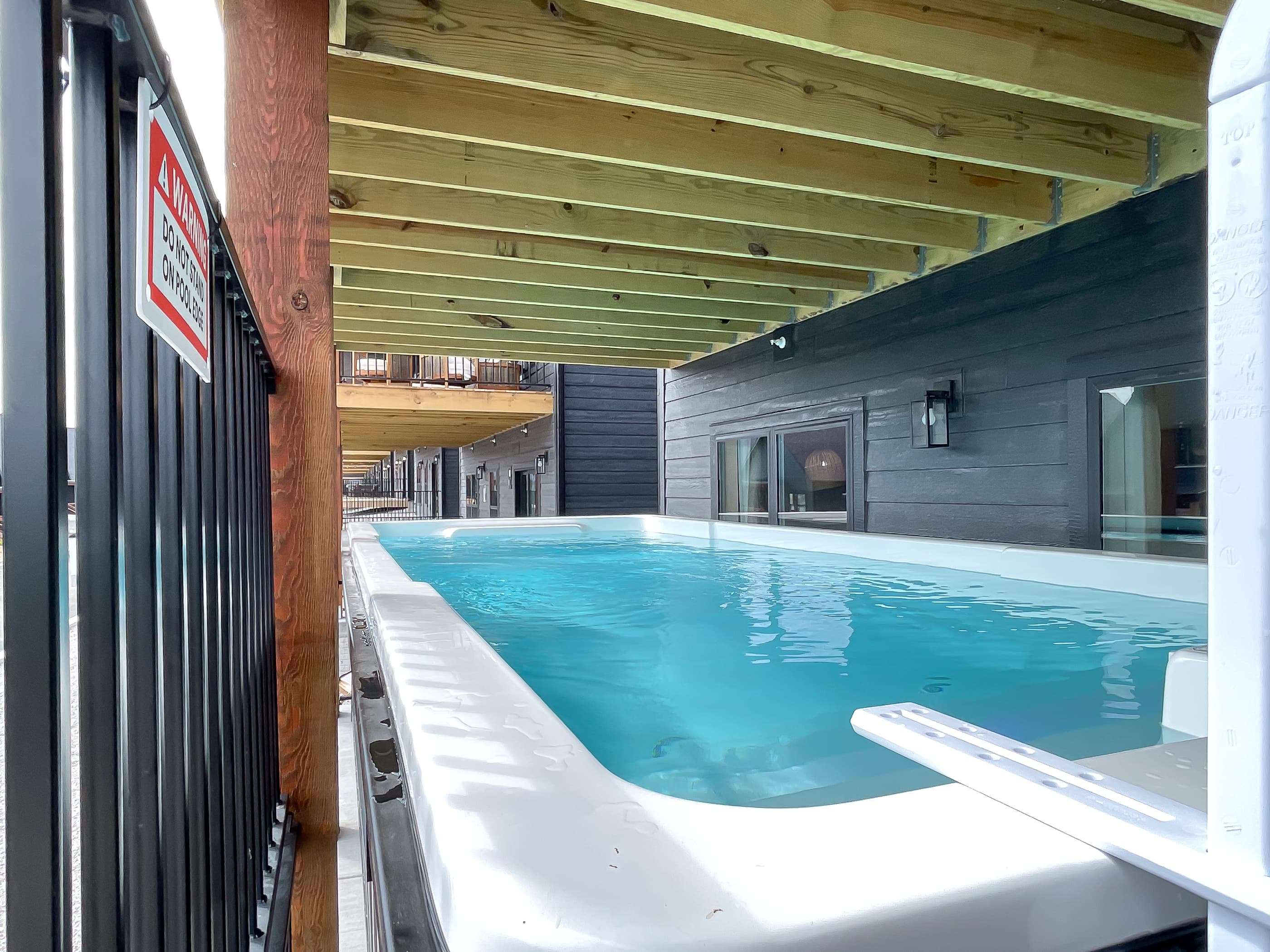 Heated container pool on lower level