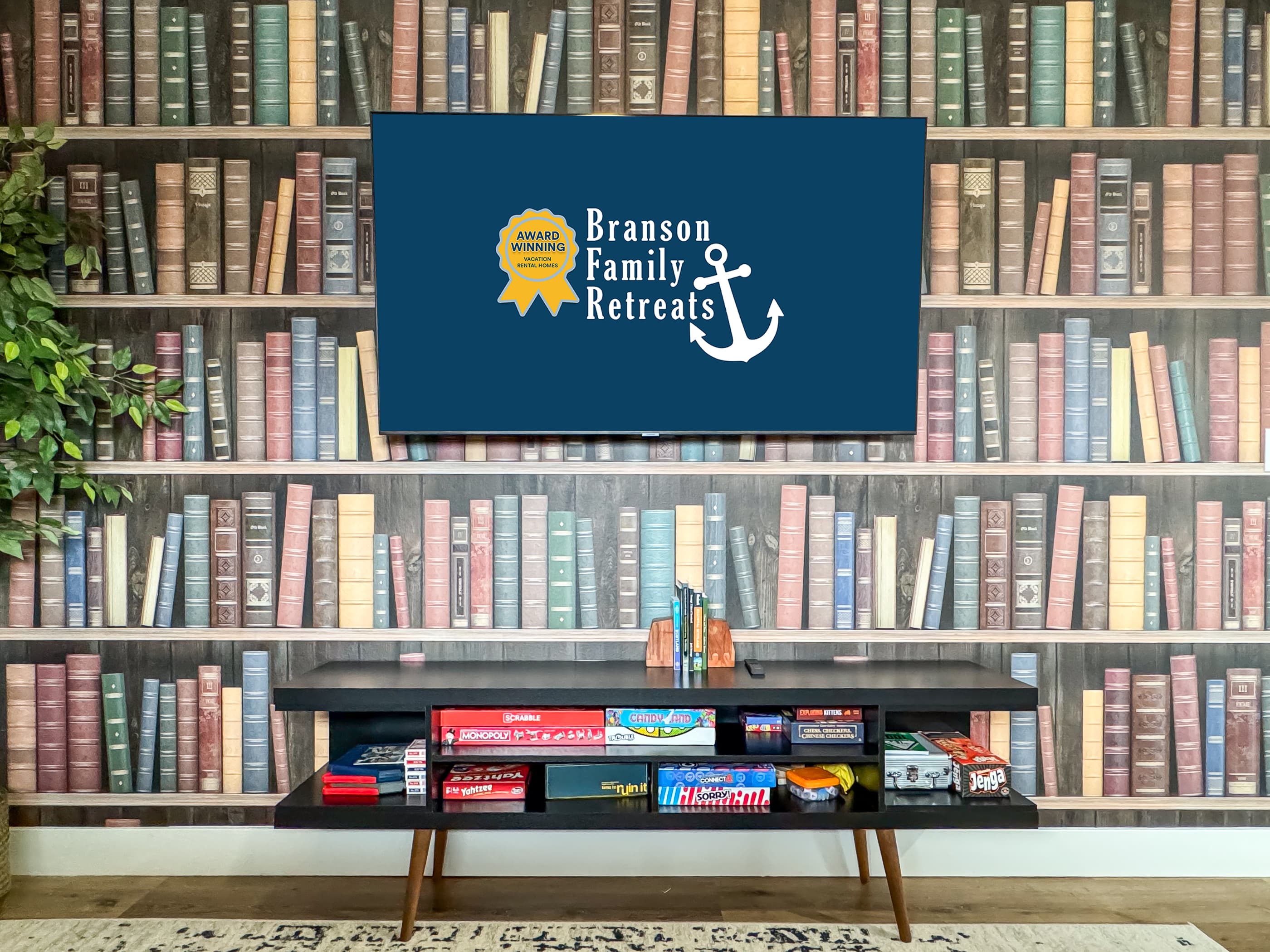 Media center stocked well with board games and smart tv in lower level family room
