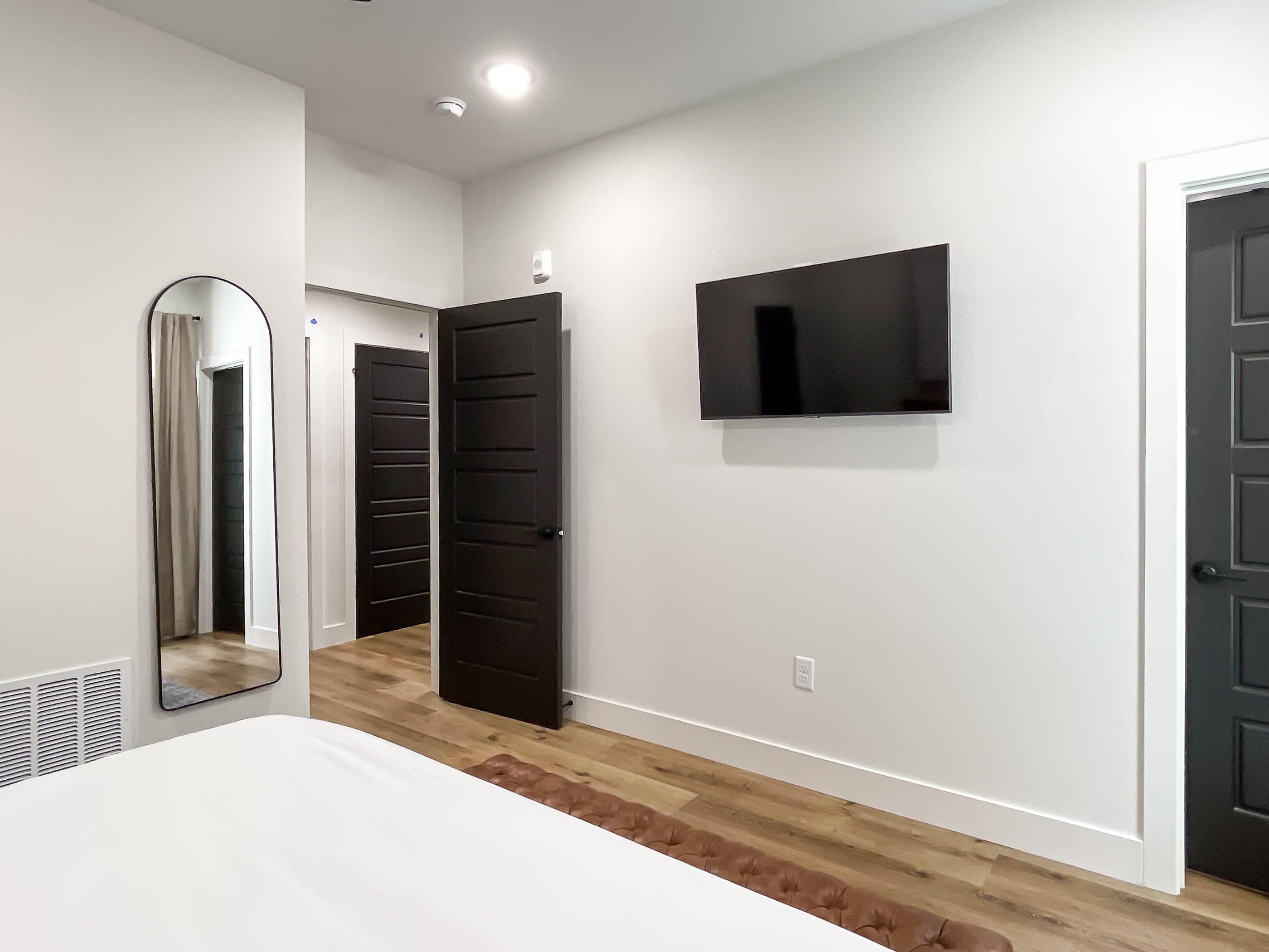 Spacious lower level bedroom with smart tv and en suite bathroom