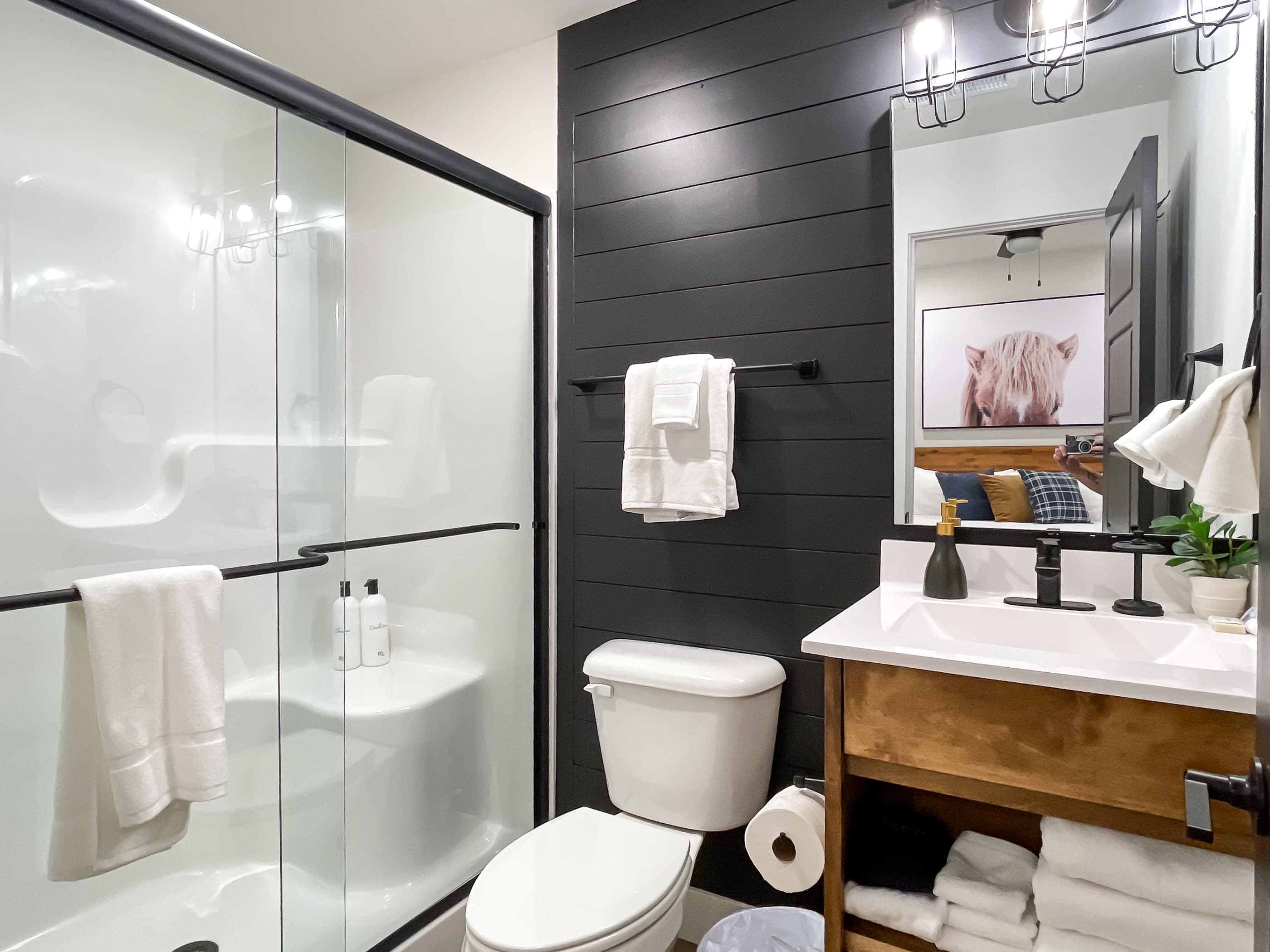 Lower level en suite bathroom with step in shower with built in seat