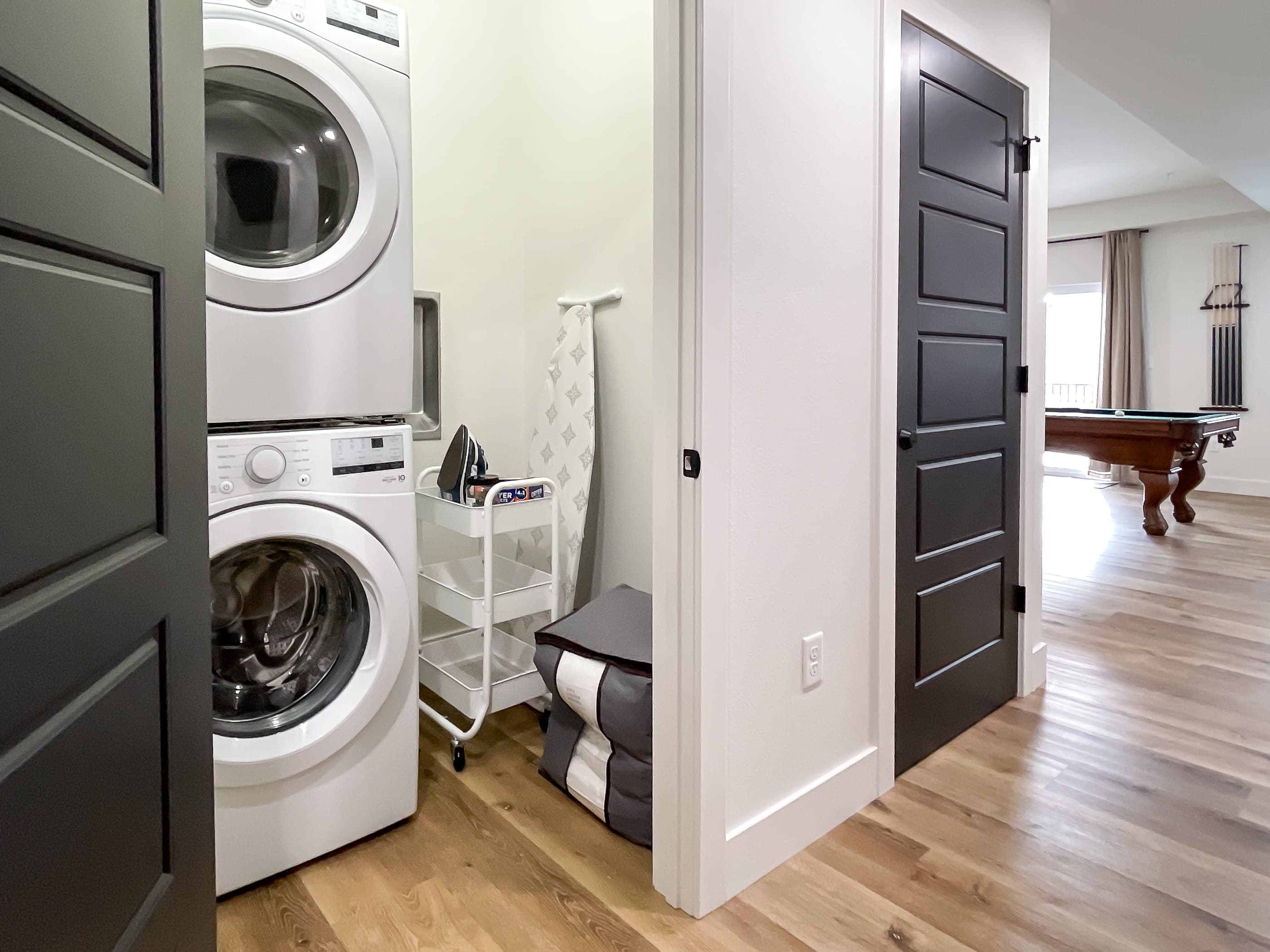Washer/dryer combo, sleeper sofa linens, and ironing board with iron
