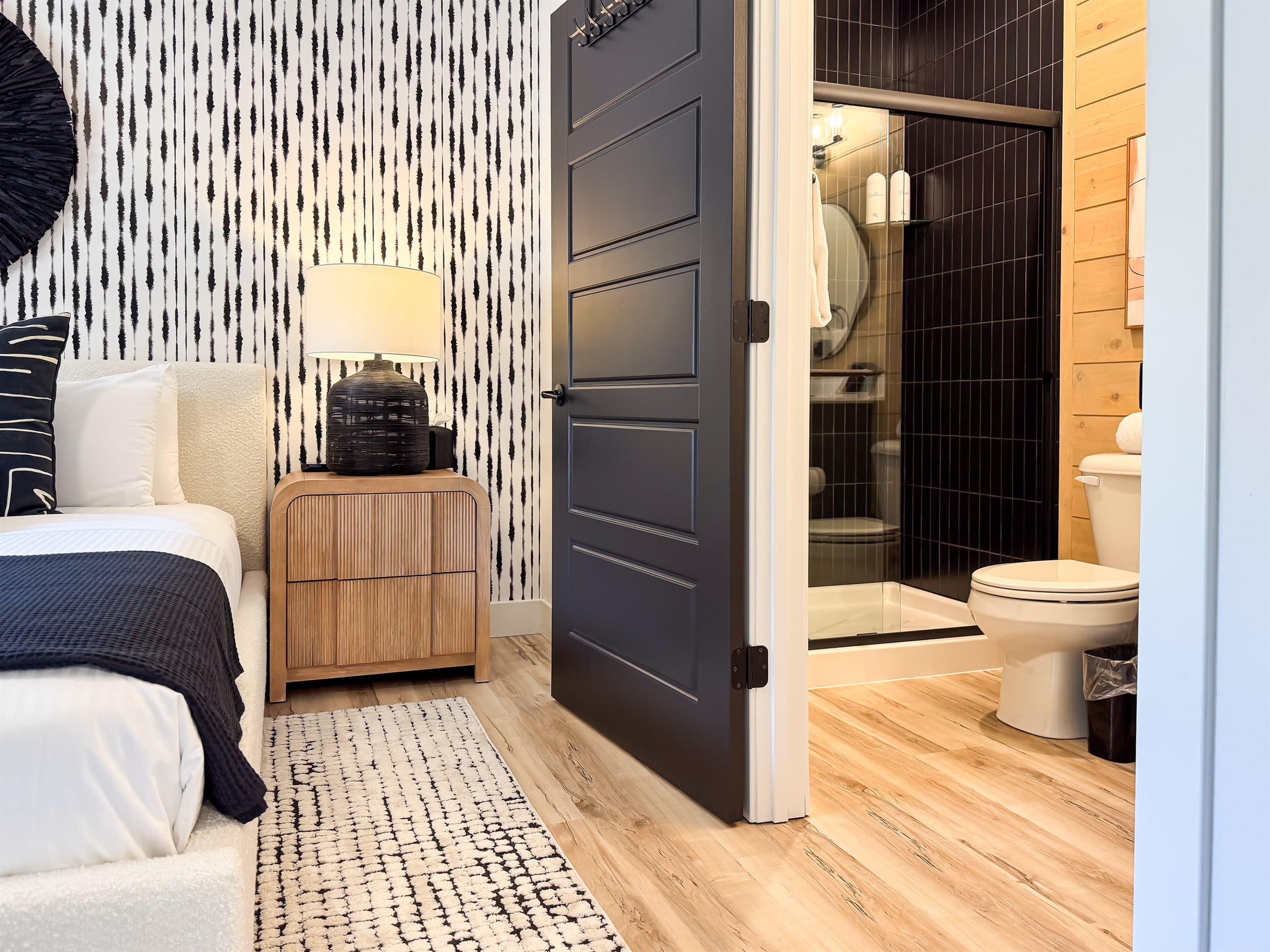 Bedroom 1: King bed with night stands and to the right the en-suite bathroom
