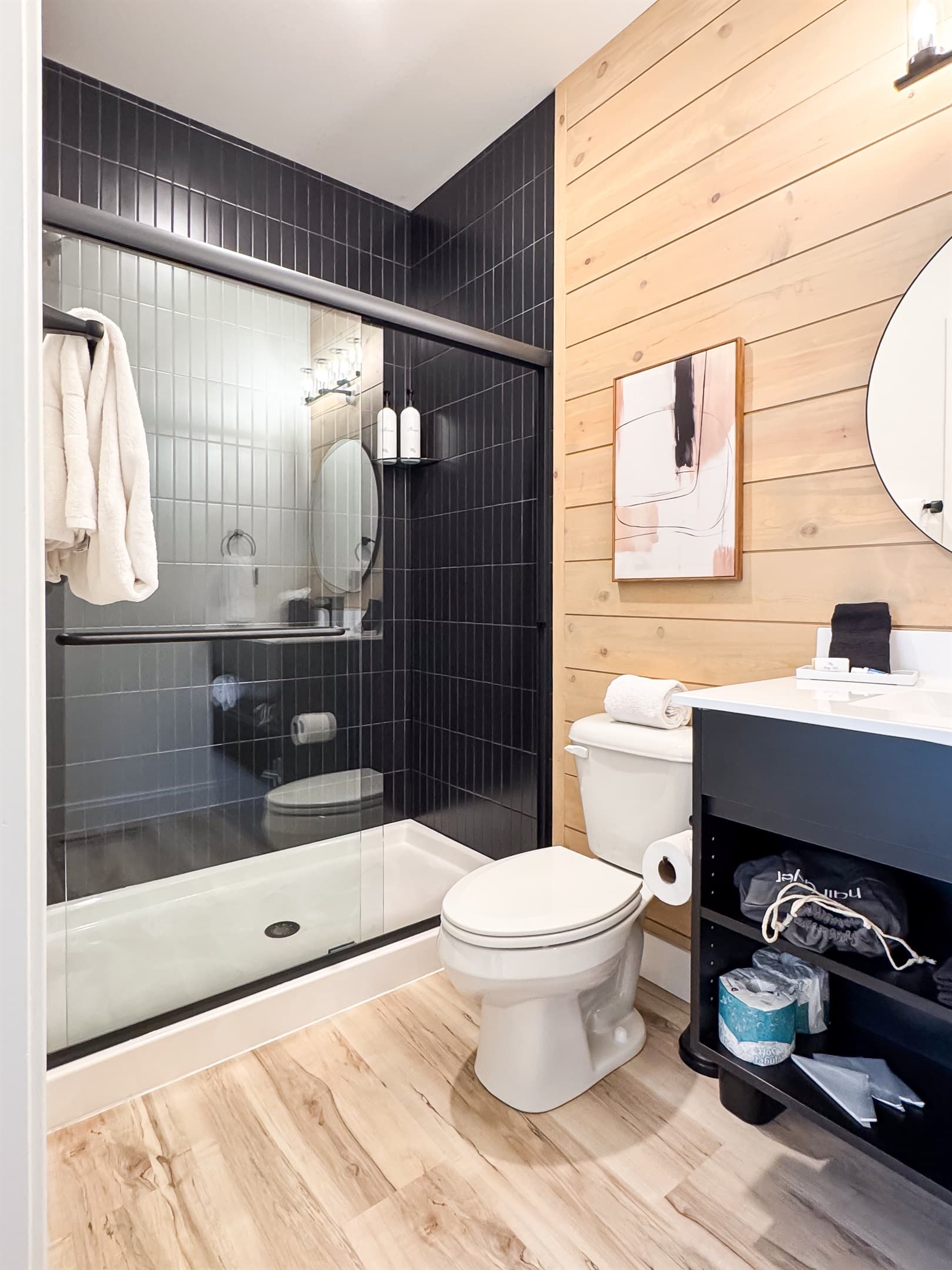 Bedroom 1: En-suite bathroom with a low curb shower, toilet, and vanity