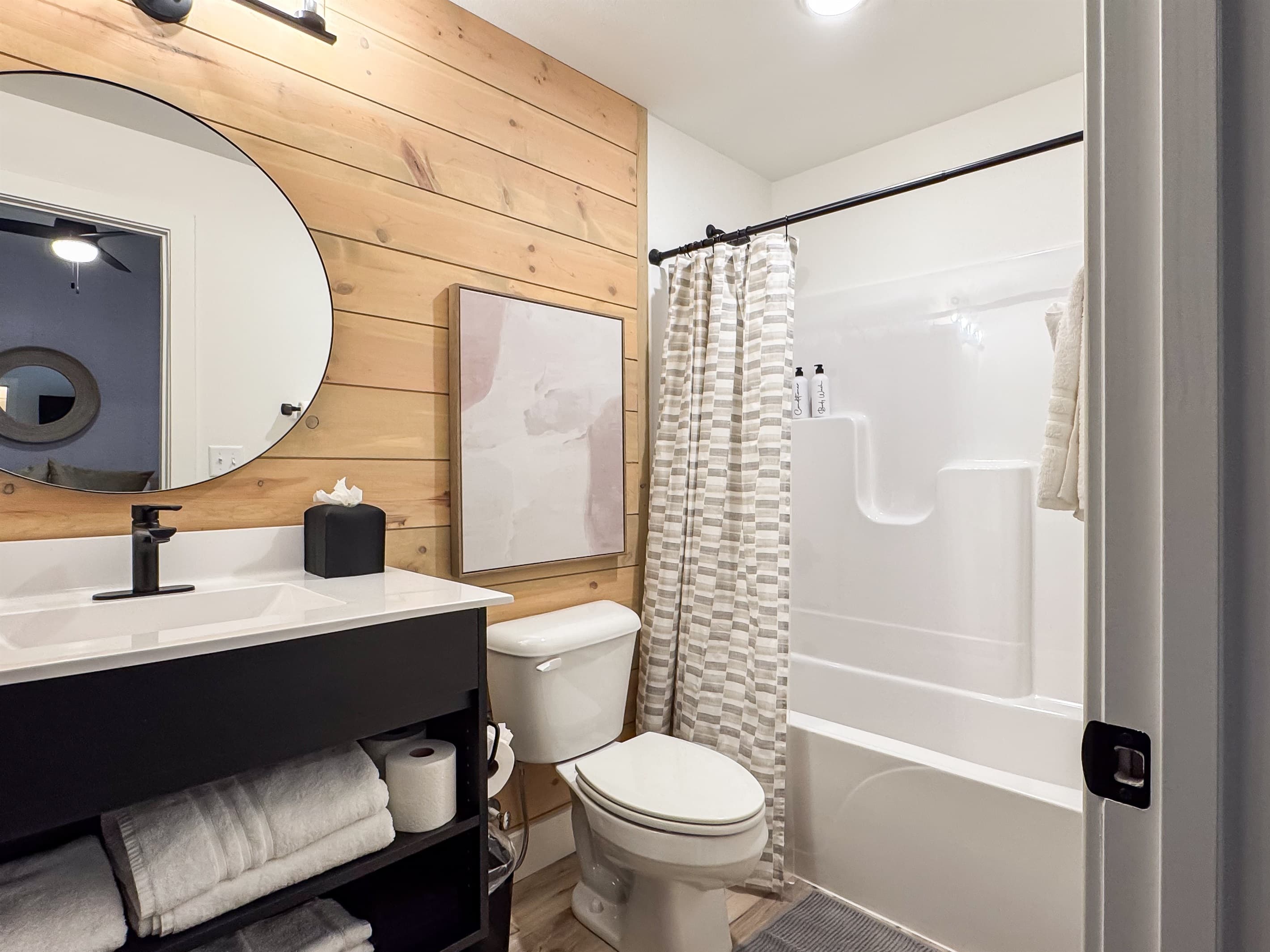 Bedroom 4: En-suite with tub shower, toilet, and vanity